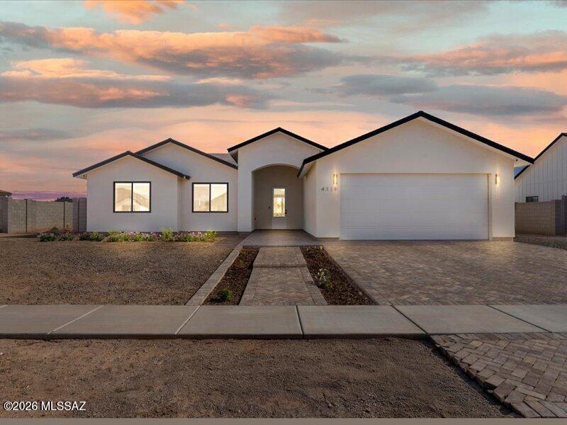 High ceilings and an open great room set the tone for this well-designed 2023 new build in Cotton Valley Farms. The kitchen offers abundant cabinetry, under-cabinet lighting, RO system, and a large island with breakfast bar. Luxury vinyl plank flooring runs through the main living area, with custom tile shower and tub surrounds for a clean, finished look. The insulated oversized garage is pre-plumbed and wired for HVAC and includes a whole house water filtration system, plus convenient attic storage. Tankless gas water heater provides instant hot water, and the mud room is pre-plumbed for a washout sink. Paver driveway and walkway, grass, and landscaping on sprinkler and drip systems. Spacious bedrooms, walk-in master closet, attic storage space, and a prime Thatcher location. Owner/agent