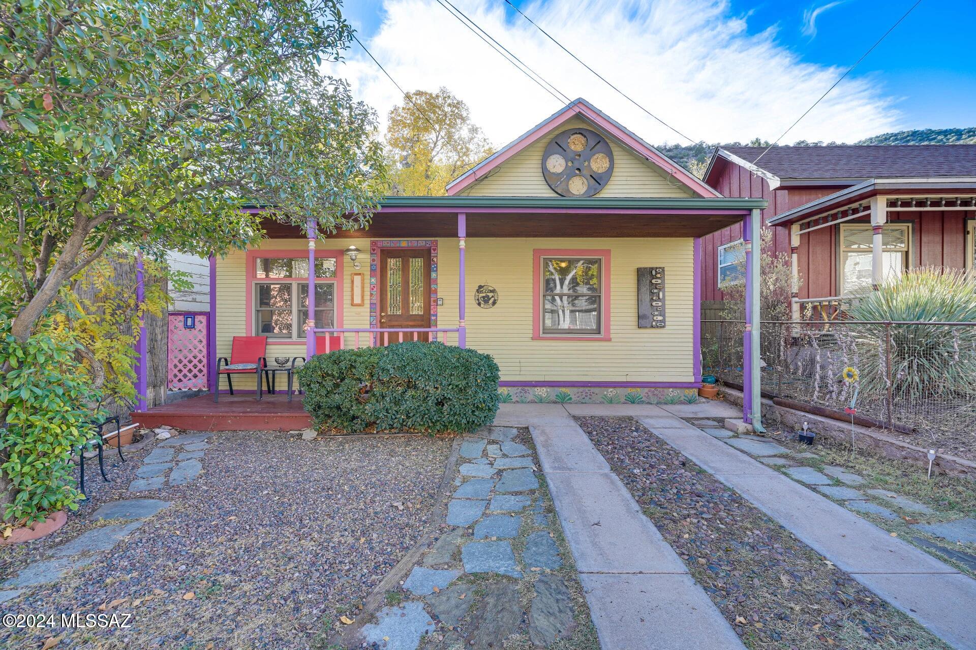 Welcome to one of the most charming properties in the heart of beautiful Old Bisbee! This thoughtfully updated historic home features a spacious main residence and a separate guest cottage, creating endless possibilities for guests, extended family, a private office, artist's studio, rental income, or simply additional living space. Perfectly positioned just moments from Bisbee's beloved restaurants, galleries, shops, and live music venues, the location is truly exceptional. Leave your car parked and enjoy the unique lifestyle that makes Old Bisbee so special. A tranquil private courtyard creates a peaceful connection between the main home and the cottage, offering an inviting outdoor space for relaxing, entertaining, or enjoying Bisbee's beautiful weather. The main home features two... spacious bedrooms, one bathroom, a dedicated laundry room, and a bright, open living and kitchen area filled with natural light. The detached guest cottage offers approximately 325 square feet of additional living space, complete with its own kitchen, bathroom, and private yard.
Private off-street parking for two vehicles is a rare and highly desirable amenity in Old Bisbee. Combined with the property's outstanding condition, recent upgrades, and prime location, this home offers a unique opportunity to enjoy the very best of Bisbee living.
Tucked away just enough to provide peace and privacy, yet close to everything, this special property captures the charm, character, and convenience that make Old Bisbee such a treasured destination.

Welcome home to one of the sweetest and most versatile properties in Old Bisbee.