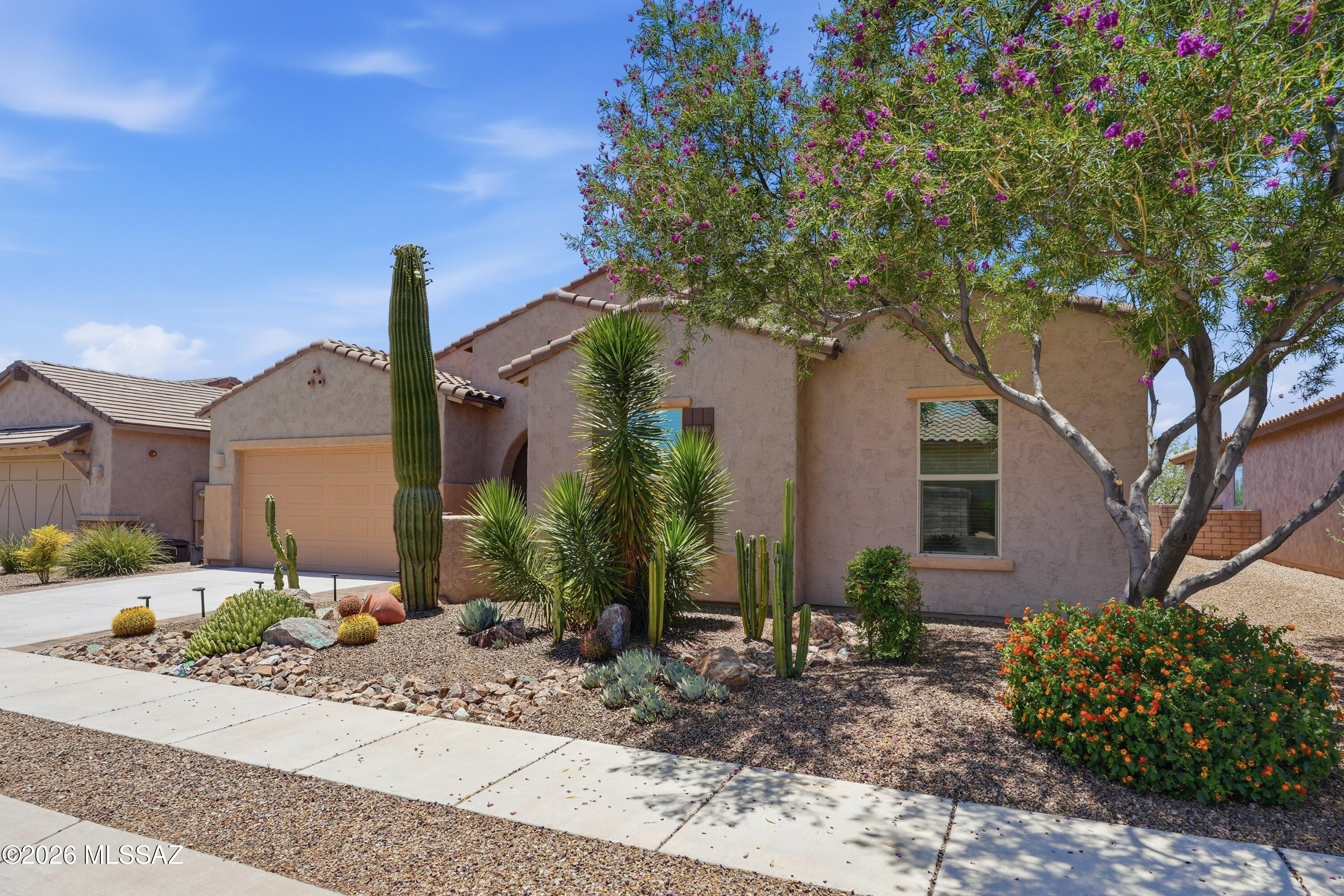 Welcome to 4370 W Summit Ranch Place, a beautifully designed home with 4 Bedrooms and 2 1/2 baths with 3,047 Sq Ft. and a three-car garage in the sought-after Sky Ranch community of Marana. Built by Meritage Homes, this residence offers modern comfort and energy efficiency with spray foam insulation for year-round savings. Inside, enjoy an open-concept layout where the great room flows into a stylish kitchen featuring sleek granite countertops, a large island, double convection oven, and walk-in pantry. The spacious primary suite provides a relaxing retreat, while additional bedrooms offer flexibility. Step outside to a resort-style backyard with a Pebble Tec pool and charming gazebo, perfect for entertaining. Conveniently located near parks, shopping, dining, and more.