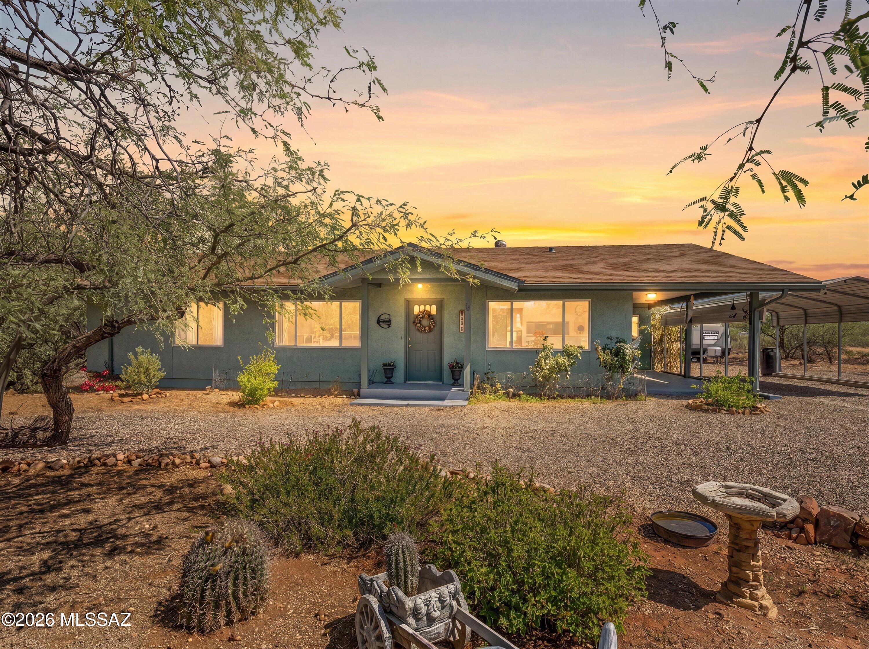 Discover a private desert retreat perched on over an acre of land, offering breathtaking panoramic views of the surrounding mountains. This thoughtfully expanded home features professionally permitted additions, including a spacious great room that opens seamlessly to an exceptional outdoor living area.
Outdoors, enjoy resort-style amenities including a pool, spa, and gas fire pit--perfect for entertaining or relaxing while taking in the spectacular scenery.
The property is enhanced by 17 mature fruit trees, including peach, fig, and citrus varieties, creating a lush, productive landscape. Additional features include RV parking with water and electrical hookups, two storage sheds, and a rainwater harvesting system. NEW interior paint and Newer HVAC system.
