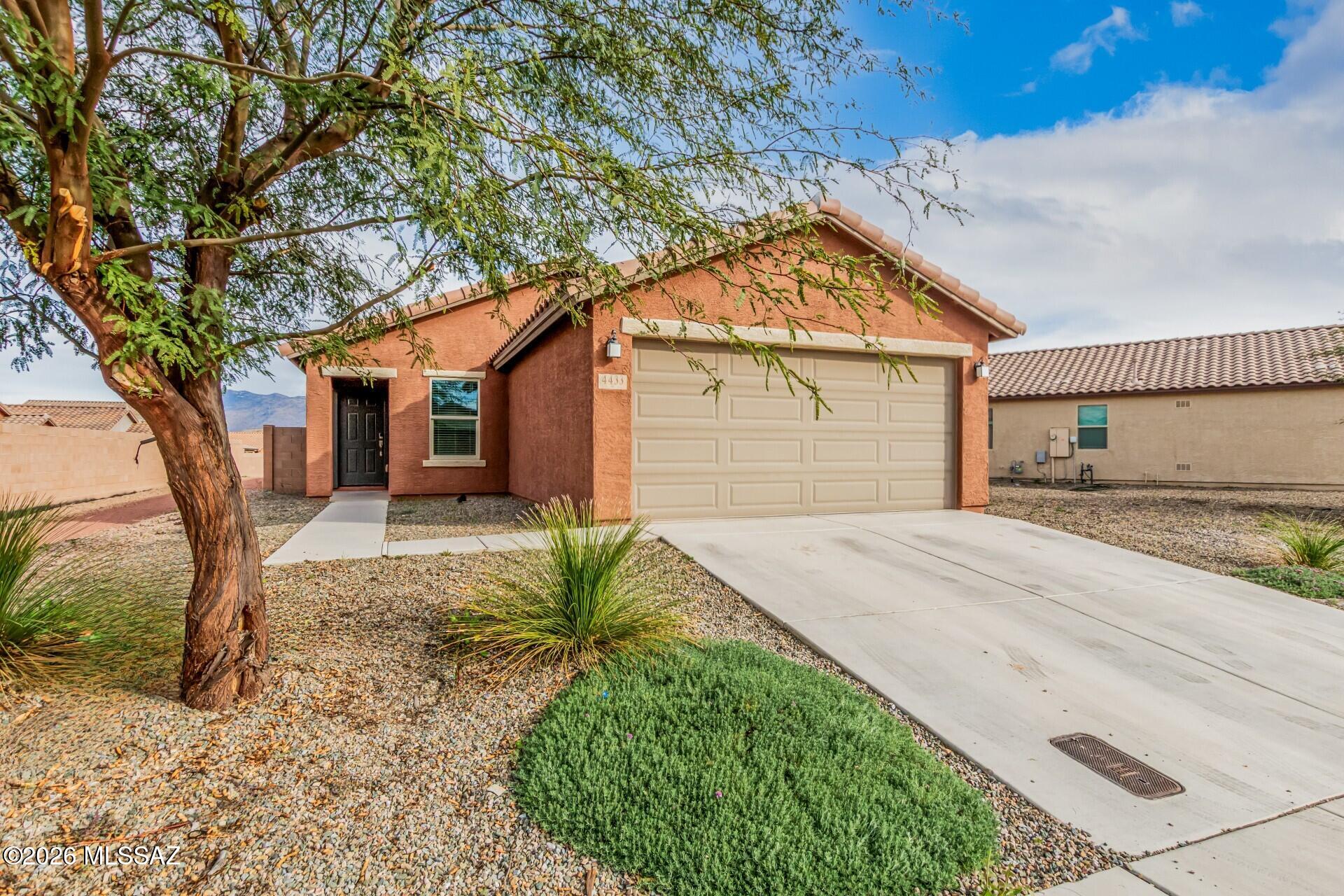 NOW TAKING BACKUP OFFERS  Move in ready 2021 Bella Tierra home with a park-side lot and Rincon Mountain views. This well maintained 3-bed, 2-bath sits on a fenced lot backing to a neighborhood park. A  hard-to-find combo for privacy, open space, and everyday enjoyment. Inside, the open-concept great room features tile flooring and recessed lighting, the kitchen delivers what buyers want most: granite counters, stainless appliances, and a spacious walk-in pantry. The split-bedroom layout keeps the Owner's suite private, with dual sinks, a large walk-in closet, and a full-size walk-in shower. Enjoy the covered patio and take in the Rincon views. Close to Lincoln Regional Park, schools, shopping, and entertainment--this one checks the low maintenance, newer build, great lot boxes.