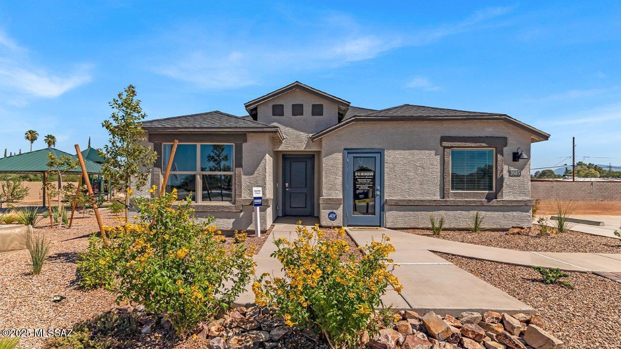Model Home Lot with Backyard Landscape included! Welcome to Senita Crossing, where spacious living meets convenience! Our newest Tucson community boasts this open floor plan ideal for modern living. Enjoy the perks of a community park just steps away, with easy access to I-10, DMAFB, TIA, University of Arizona, and Downtown Tucson. Inside, you'll find a host of premium features, including stainless steel appliances (microwave, dishwasher, gas range), walk-in pantry, white shaker cabinets, granite countertops, and tile flooring in most areas. Embrace the future with smart home technology. Plus, enjoy the convenience of water filtration at the kitchen sink and the added efficiency of a radiant roof barrier. Don't miss out on the opportunity to make Senita Crossing your new home.
