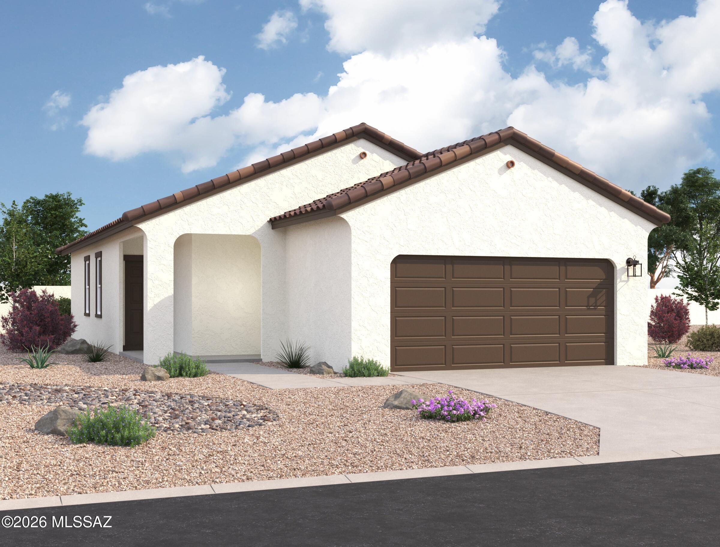 The Benmore plan is brand new and so practical!  This is a corner lot with landscaped common area behind it so no one behind. Beautiful, brand-new homes featuring thoughtfully designed floorplans in the scenic Tucson community of Star Valley! Conveniently located with easy access to I-19 and major Tucson destinations, this community offers the perfect balance of comfort, convenience, and outdoor living. Homes showcase desirable upgrades including 9' ceilings, white shaker cabinets, Shaw 17'' x 17'' tile flooring, and granite kitchen countertops. Each home comes move-in ready with stainless steel kitchen appliances, including a refrigerator, washer, and dryer. Energy-efficient features include Low-E dual-pane windows and a Wi-Fi programmable thermostat to help maximize comfort and savings. Exterior highlights include front yard desert landscaping with irrigation, covered patios, and spacious backyards designed for enjoying Tucson's beautiful sunsets. Residents enjoy community amenities including large park with soccer fields; walking paths and natural trails; children's play area; basketball courts; tennis courts; pickleball courts; natural-area dog park and incredible mountain views everywhere! This welcoming community offers the perfect combination of modern living and the natural beauty of the Tucson desert.