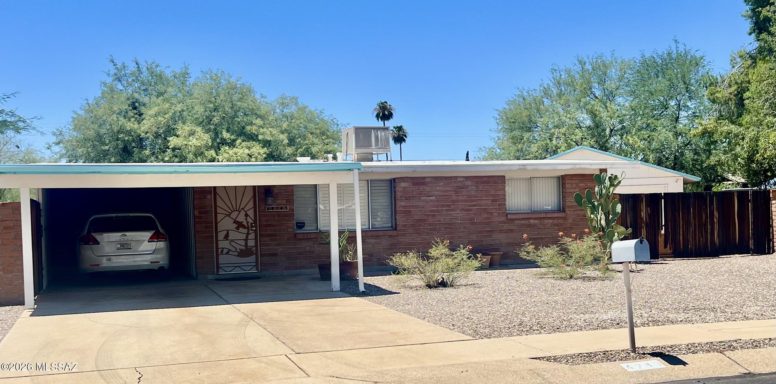 You won't want to miss the rare opportunity to make this mid-century house your own. For the very first time on the market, this one-generation-owned home is ready for its next chapter. Boasting structural integrity and good bones, the property has been priced intentionally to allow the next owner room for custom updates and personalized modern renovations. This 3-bedroom, 1-bath home is conveniently located in the low-turnover, pocket neighborhood of North Manor; the home sits on an expansive lot with an oversized 2-car garage/workshop accessed via a double-fenced gate, plus an additional 3-spot covered carport attached to the front of the home. Step out back to a large covered patio and backyard offering endless possibilities. No HOA. The community has a voluntary Improvement Association This structure keeps community upkeep active while preserving individual property rights. Bring your design vision and build immediate sweat equity in a high-demand community where homes are rarely made available! Arizona-licensed listing agent is related to the sellers.