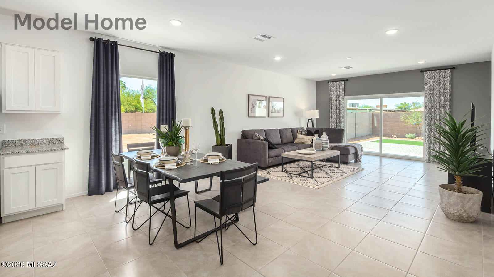 Step into The Gaven, a thoughtfully designed single-story new home nestled within the inviting Saguaro Bloom community. With 1,815 square feet of living space, this home offers four bedrooms and two bathrooms, ideal for those seeking a blend of functionality and modern style.
As you enter through the front porch, the foyer opens up to reveal a spacious and open layout that flows seamlessly from the entryway to the living areas. The great room serves as the heart of the home, connecting effortlessly to the dining area and kitchen, making it a perfect space for both relaxation and entertaining Our most energy efficient ZERO ENERGY READY home with spray foam insulation, tankless water heater, solar prewire and energy star rated appliances.