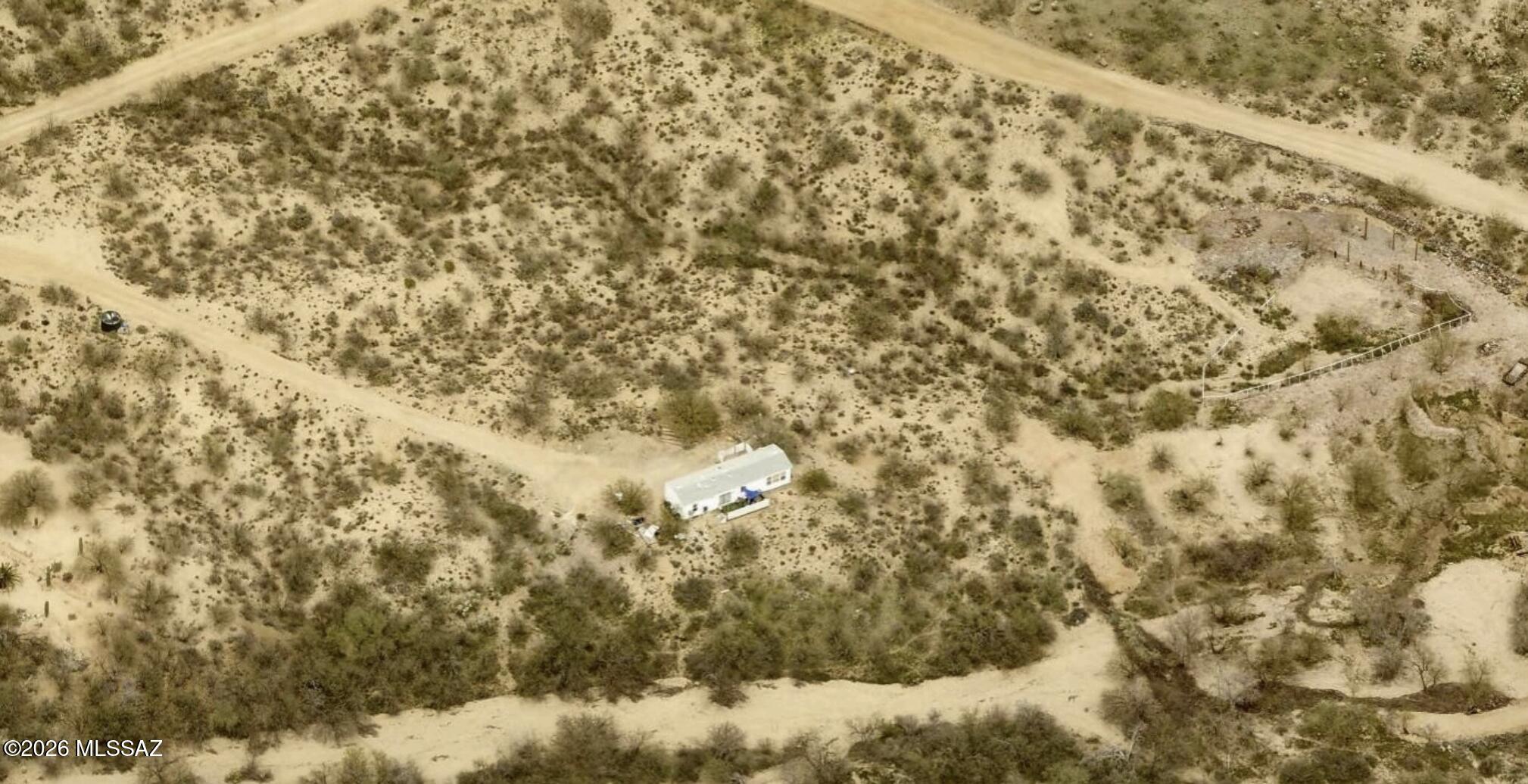 Situated on over 4 acres, this 1-bedroom, 1-bath manufactured home presents a unique investment opportunity in a private rural setting. Zoned for horses with lots of space for corrals, RV parking, trailers, equipment, or future improvements. The property offers privacy, wide-open views, and flexible potential for renovation or redevelopment. Conveniently located within reach of town amenities while still offering the space and seclusion of private desert living. A rare chance for investors or buyers with vision to unlock the full potential of this property.