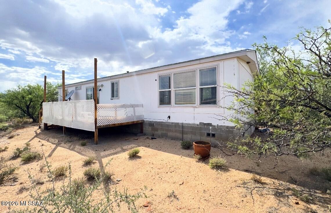 Situated on over 4 private acres, this 1-bedroom, 1-bath manufactured home presents a unique investment opportunity in a peaceful rural setting. Zoned for horses with ample space for corrals, RV parking, trailers, equipment, or future improvements. The property offers privacy, wide-open views, and flexible potential for renovation or redevelopment. Conveniently located within reach of town amenities while still offering the space and seclusion of private desert living. A rare chance for investors or buyers with vision to unlock the full potential of this property.