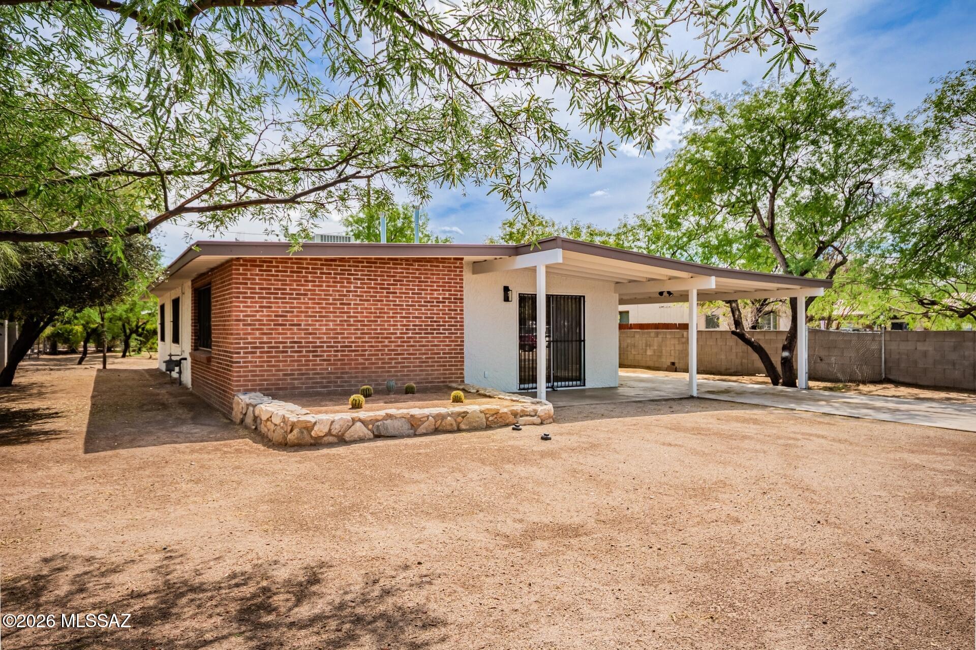 Seller will counter of accept offers between $319,500 - $339,500. Remodeled single-family home on a large lot in the desirable Limberlost neighborhood, just north of Grant Rd and minutes from Tucson Mall--offering easy access to major roads, shopping, and dining. This 3 bed, 2 bath home features luxury plank flooring throughout with plush carpet in the bedrooms, fresh interior and exterior paint, and a brand new AC for year-round comfort. The updated kitchen showcases beautiful brown cabinetry, quartz countertops, a stylish tile backsplash, and stainless steel appliances. Both bathrooms have been upgraded with modern fixtures and eye-catching tile shower surrounds. The spacious lot offers plenty of room to enjoy with refreshed landscaping and endless possibilities. Move-in ready!