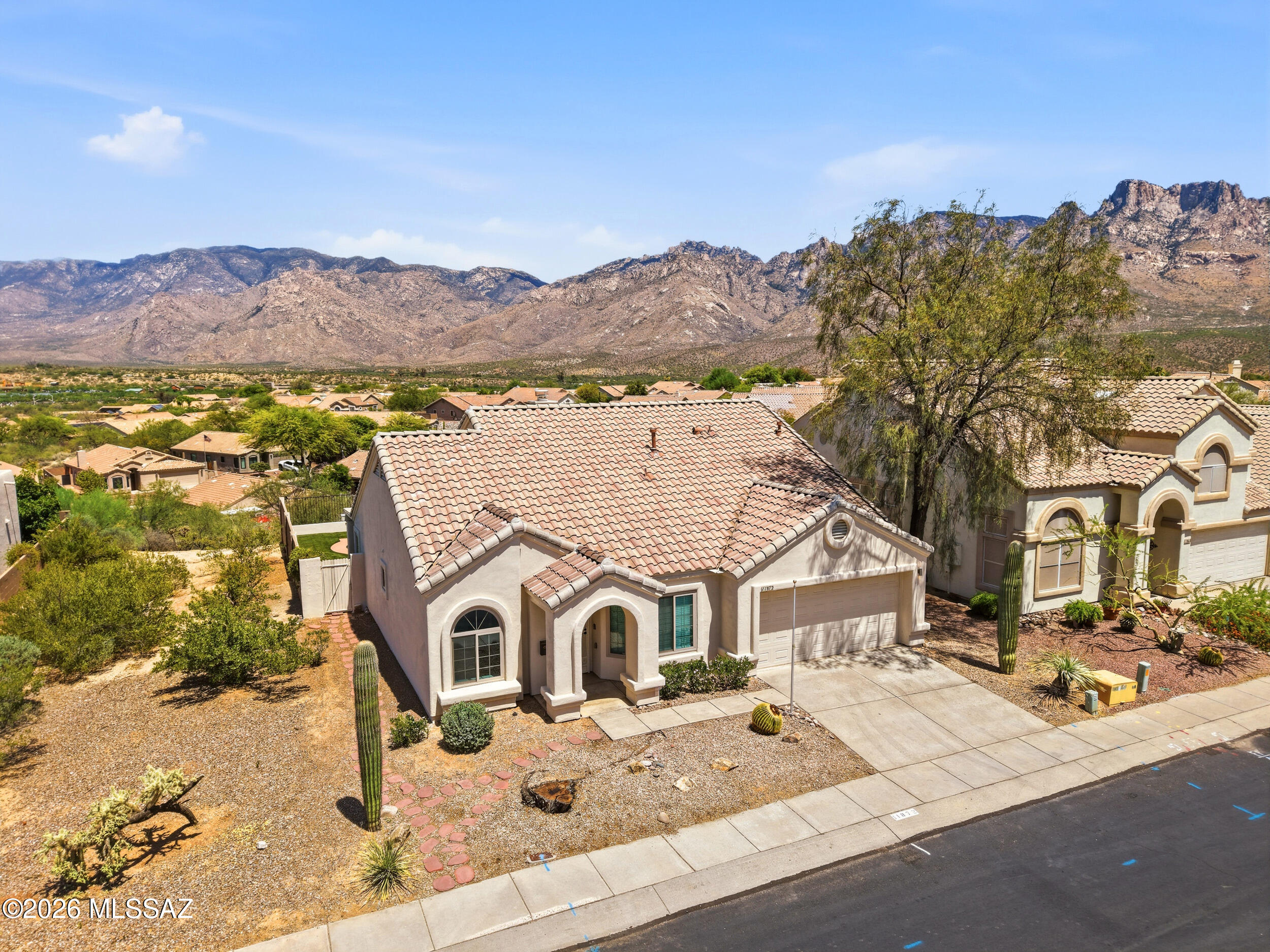 Great home, great location, great views! This 1,340 SqFt, two bedroom + den, two bath home backs up to open space and captures stunning mountain views. Inside, the open layout with tall ceilings creates a spacious feel. The kitchen features quartz countertops, a farmhouse sink, and abundant storage. The spacious living room offers a cozy fireplace. The den includes a closet that can easily convert to a 3rd bedroom. Updated bathrooms feature grab bars. Upgraded windows throughout. Relax year round in the pebble tech pool and hot tub. Near shopping, dining, and medical. It is worth taking a look.