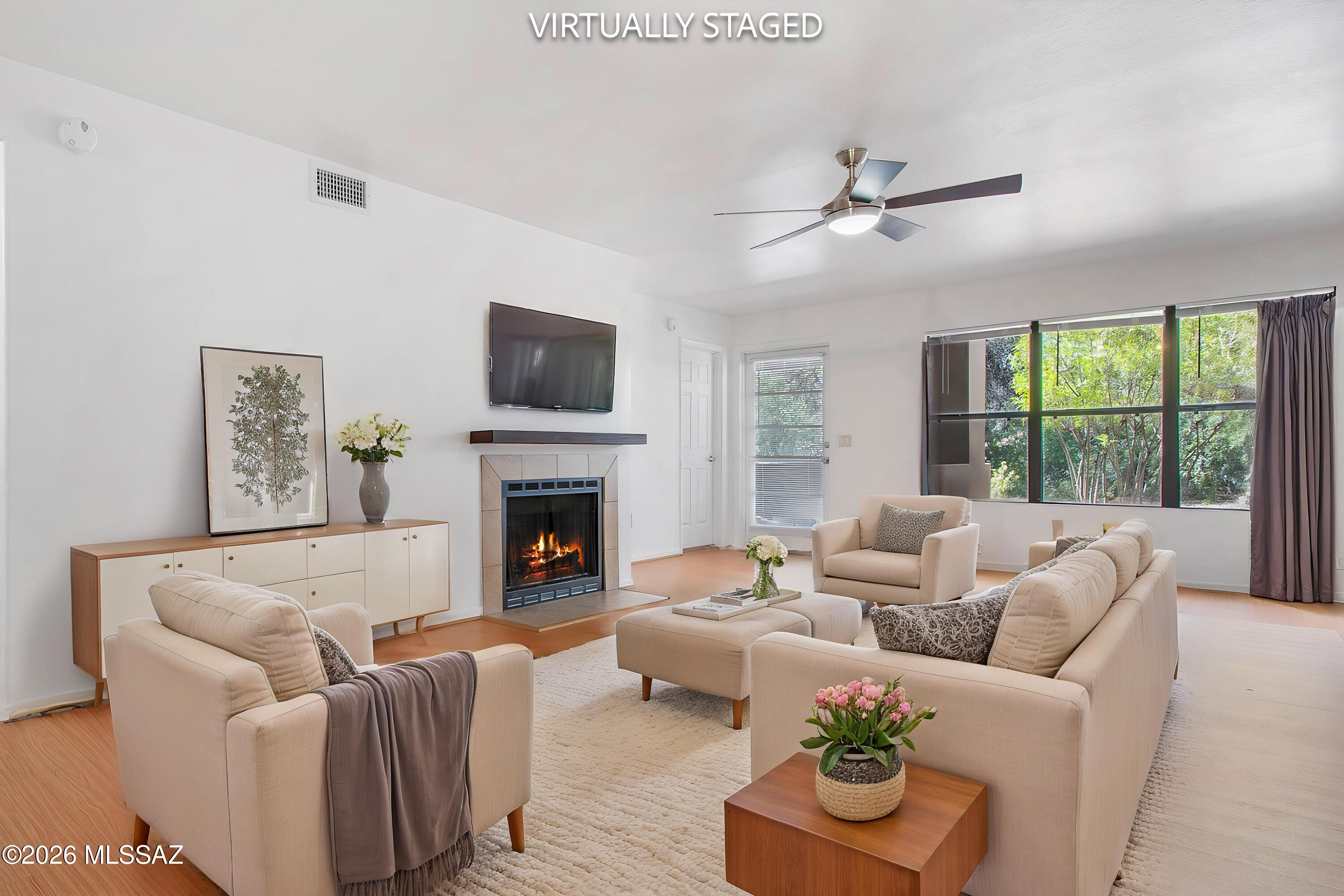 Highly coveted first-floor condo in The Greens with premium desert views! Enjoy effortless resort-style living in this immaculate, move-in-ready home. The desirable split-bedroom floor plan features a spacious great room with a cozy fireplace, all overlooking a lush, peaceful natural desert greenbelt buffer. Enjoy easy-care maintenance with modern plank flooring throughout (no carpet!). Just steps away from the sparkling community pool and spa. Unbeatable location close to premier golf, dining, shopping, and outdoor recreation. Perfect as a primary residence, winter getaway, or low-maintenance investment property!