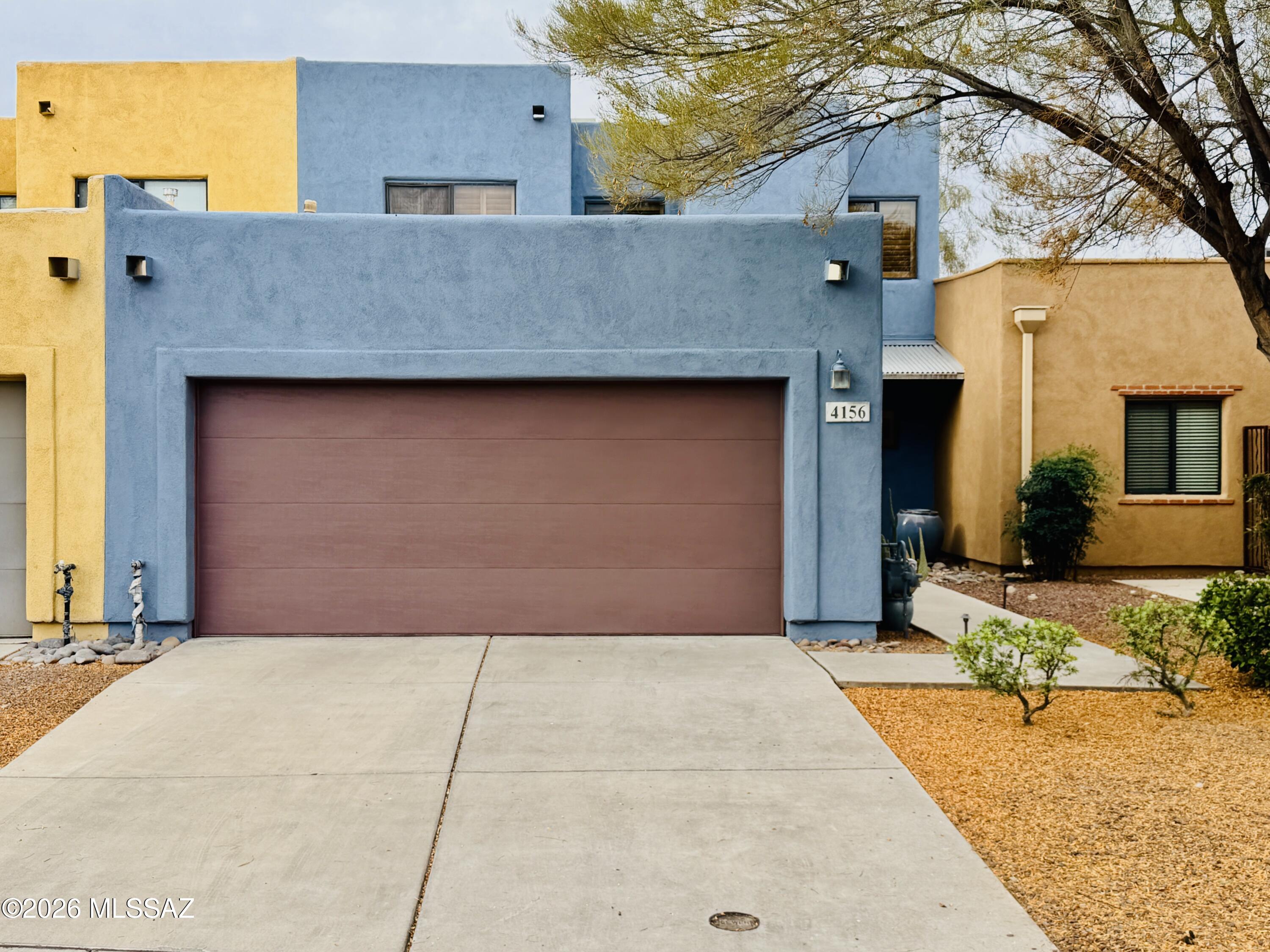 Beautifully refreshed central Tucson townhome located in the desirable Mountain Hollow community! This spacious 3 bedroom, 2.5 bathroom home features an open and functional floorplan with soaring ceilings, abundant natural light, and a 2-car garage. Recent updates include fresh interior and exterior paint, brand new carpet throughout, a serviced A/C system, and a newly coated roof, offering added value and peace of mind. The inviting layout provides comfortable living and entertaining space, all within a low-maintenance community. Conveniently located near shopping, dining, The Loop bike path, River Walk, and the University of Arizona, this move-in ready home combines comfort, convenience, and an ideal central Tucson location. Seller providing a home warranty for added buyer confidence. Potted plants, dining table set, and stools do not convey.