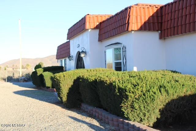 MASSIVE PRICE REDUCTION!!! Beautiful, spacious, 3bd, 2ba home with lovely views and easy access to Interstate 10 and the city of Willcox. This very nice house has been updated and so well taken care of that it feels like a new home!  New appliances in the kitchen, lovely wood beams on the ceiling in the living room and dining room area. It sits on 5 usable acres and with paved access, and a short distance to Interstate 10, so it's convenient to wherever you need to go! Sit on your back porch and enjoy your beautiful lawn with irrigation system and fenced-in yard, while you enjoy the spectacular Arizona sunsets! Nice large workshop, chicken pen, and plenty of room for all your barnyard friends! This is a super nice home in the country, and you don't want to miss this opportunity!!