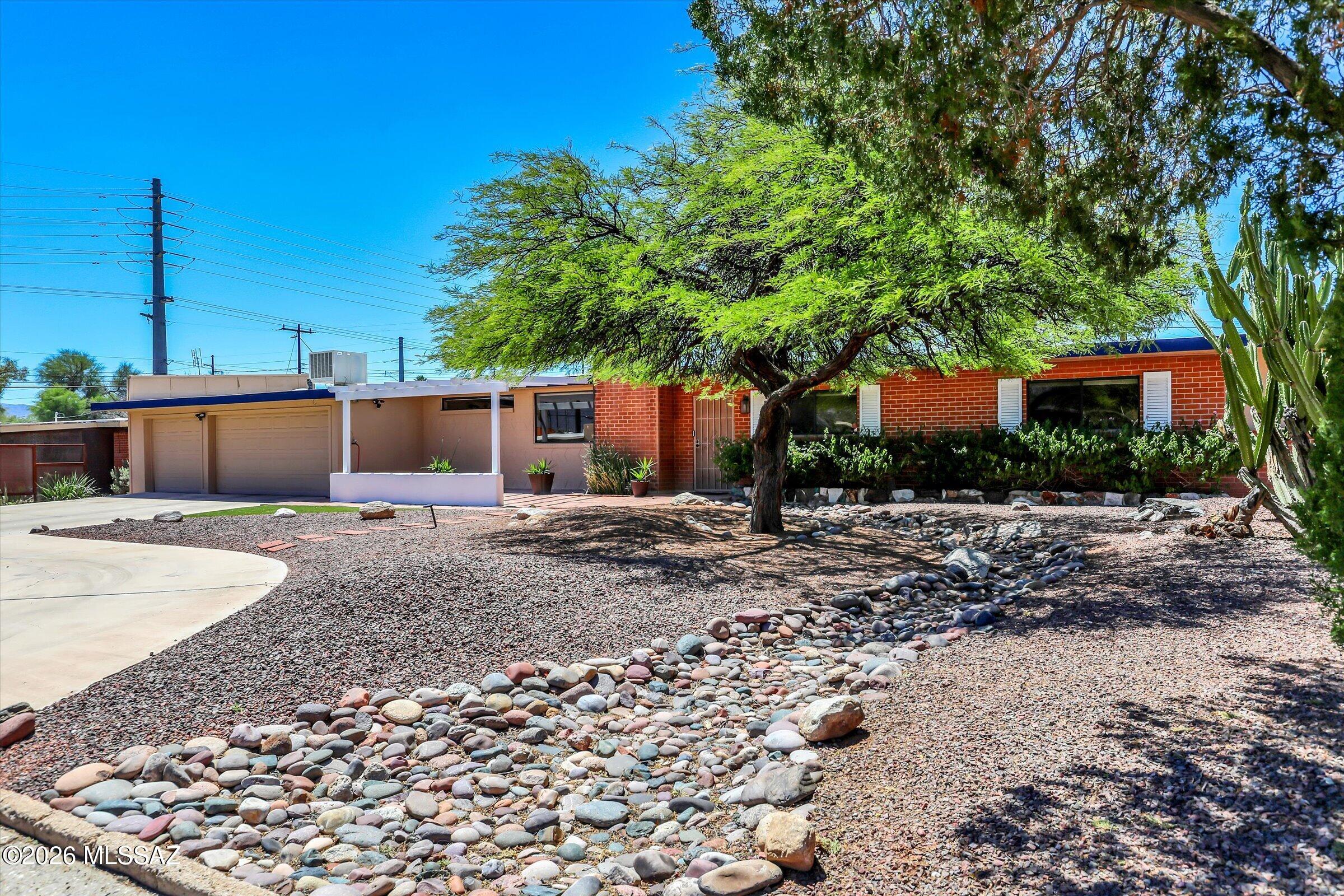 Beautiful 3 bed, 2 bath east Tucson ranch-style home located in the highly sought - after Green Hills neighborhood with neighborhood integrity. Has gated back yard pool, spacious yard, and circular driveway. This well-maintained home features a rare 3-car garage with EV charging receptacle upgraded electrical panel, recently coated roof, two storage sheds, and workshop space. Low - maintenance landscaping and a warm, inviting interior make this No HOA home truly move-in ready. Home loan is assumable through Rocket Mortgage at 2,75 and can be called if more information is needed.