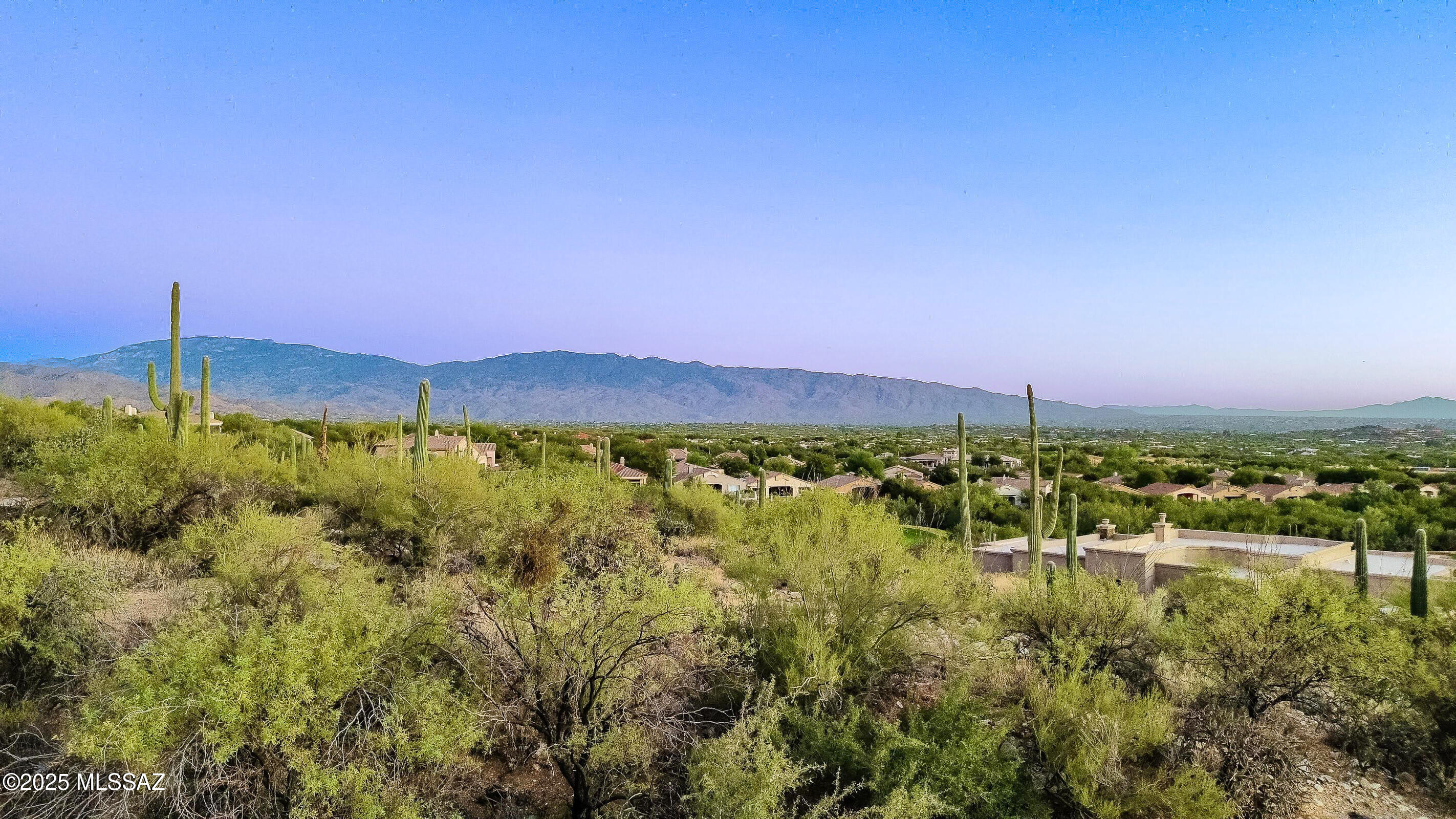 Range Price: $249,900-$259,900. Seller to review offers within the listed price range. An exceptional opportunity to build your dream home in the prestigious gated community of Sabino Estates. This elevated homesite offers breathtaking panoramic views of city lights, surrounding mountains, and stunning sunrise and sunset vistas. Perfectly positioned for privacy and unobstructed scenery, this property captures the beauty of the Sonoran Desert in every direction. As one of the last remaining lots available in this highly sought-after enclave, this is a rare chance to secure a premier location surrounded by custom luxury homes. Utilities are available at the lot line, making it ready for your vision to come to life. Building plans available upon request!