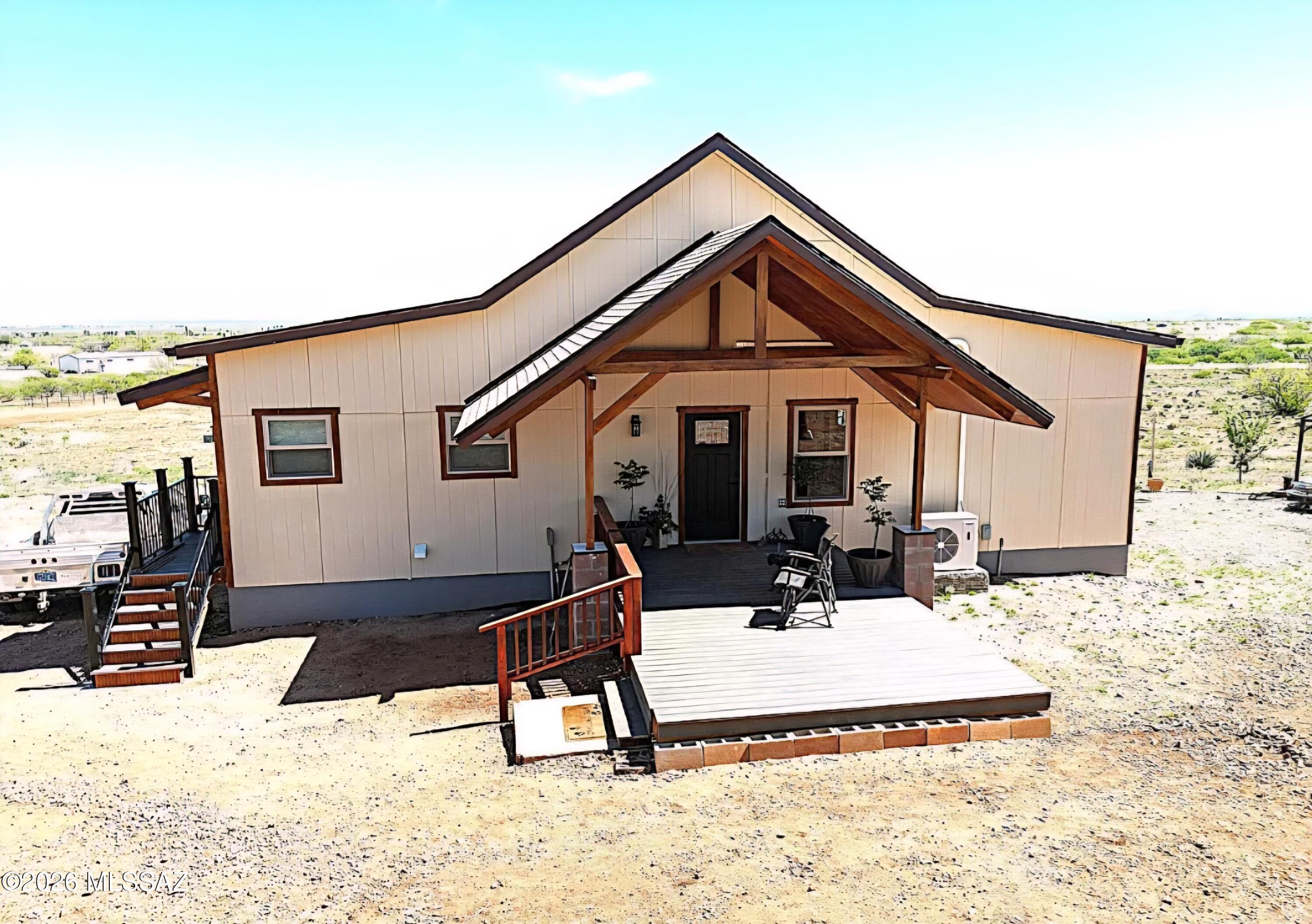 View your horses on this 10 acre panoramic property. Beautiful home overlooking the stunning mountains on your large front and back covered decks. A horse's lover's dream, with unlimited riding directly from the property available with access gates to state and federal land. The living room and kitchen opens up, exposing the ceiling. Elegant kitchen with stainless steel appliances & corian counter tops. The center island has granite with a reverse osmosis. Full basement for additional storage wine cellar, workshop or your hobbies. New private well.. two stalls next to a tack/feed building. RV hook area. Enjoy the end of a quiet country road with a gate entrance.