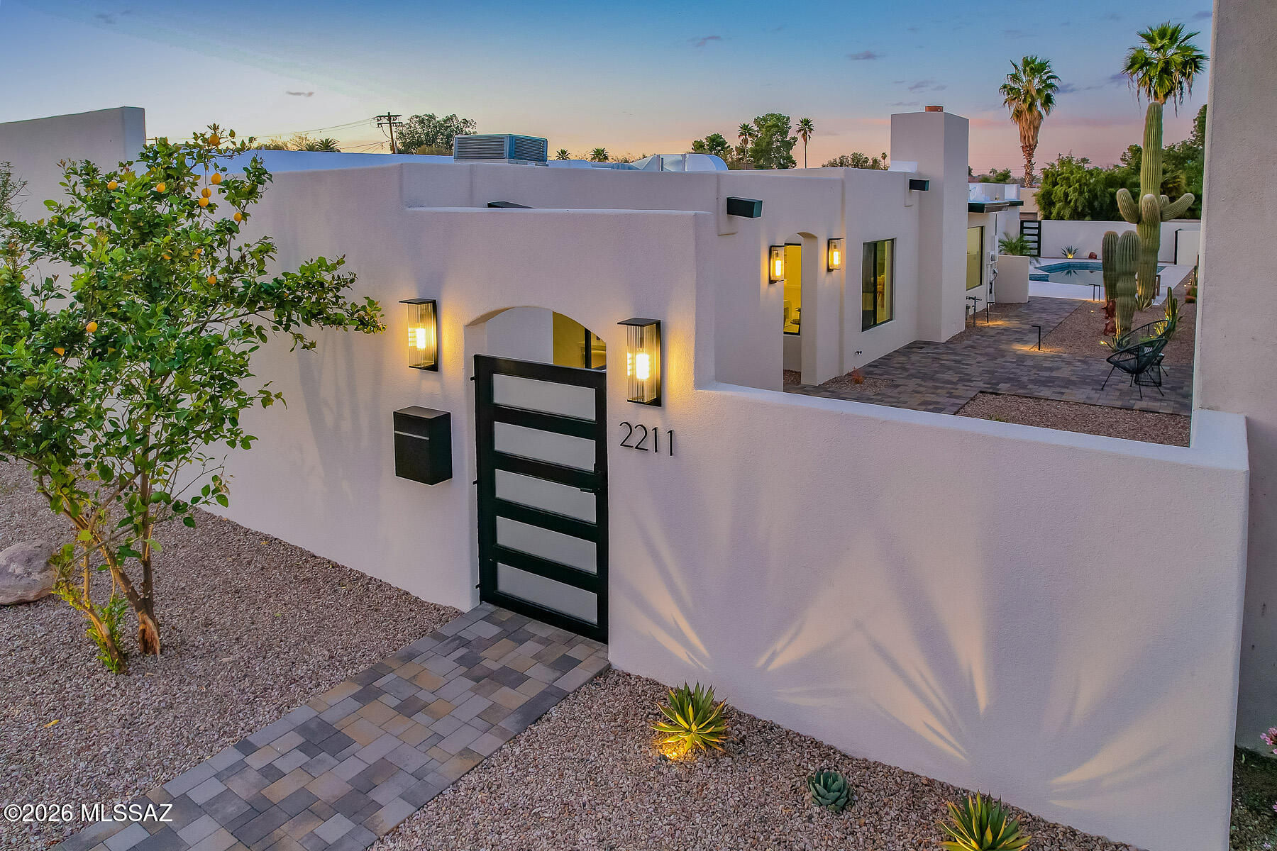 This striking Modern residence blends Architectural sophistication and trend-forward design. The avant-garde kitchen is a true showpiece, featuring contemporary, textured finishes with dreamy Butler's Pantry. With a wonderful blend of conceptual creativity and flawless execution, Tucson's own Next-Level Remodels have fashioned a mid-town showpiece into a modern Oasis. Cohesive, warm-toned finishes flow throughout the elegant, turn-key interior. Exceptional outdoor spaces with paver patios, thoughtful landscaping, sparkling refinished swimming pool, built-in BBQ and Pizza Oven. Incredible location a short walk to the Arizona Inn, U of A campus and Banner UMC.  Convenient detached 2-Car Garage w/ Epoxy flooring and large storage room.