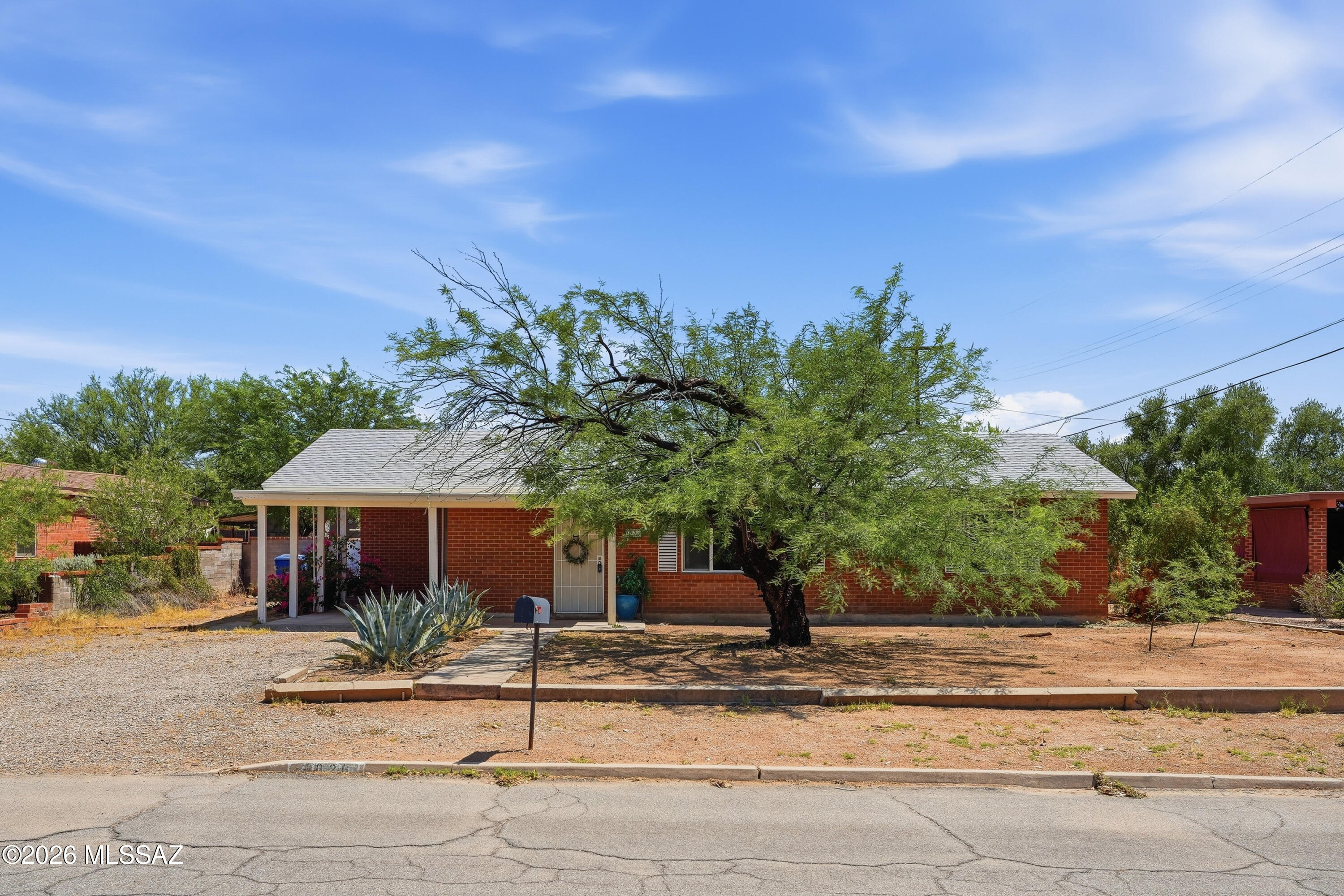 No Application Fees! Single level 2 bedroom plus den, 2 bathroom updated Tucson home in a convenient central location. This home has been updated with a modern feel and features wood laminate and tile flooring throughout with no carpeting, neutral paint, ceiling fans throughout, upgraded fixtures, and abundant natural lighting. The spacious floor plan includes a large front living room that flows into the formal dining area, creating excellent space for everyday living and entertaining. The updated kitchen features granite countertops, subway tile backsplash, newer cabinetry, pantry, stainless steel appliances, and ample cabinet and counter space. The primary suite includes direct access to the backyard patio and a private attached bathroom. The additional bedroom and separate den provide flexible space for guests, a home office, hobby room, or additional living area. Washing machine and dryer are included for convenience. Enjoy the oversized covered backyard patio, providing exceptional shade and outdoor living space year-round.

Conveniently located near shopping, restaurants, parks, schools, and major Tucson employment centers. Easy access to the University of Arizona, Downtown Tucson, Reid Park, Tucson Medical Center, and numerous entertainment and recreational opportunities throughout central Tucson.

All Denali Real Estate residents are automatically enrolled in the Resident Benefits Package (RBP) for $55.00/month which includes Renter's Liability Insurance, Credit Building to help boost the resident's credit scores with timely rent payments, up to $1M Identity Theft Protection, HVAC air filter delivery (for applicable properties), our best-in-class resident rewards program, and much more!