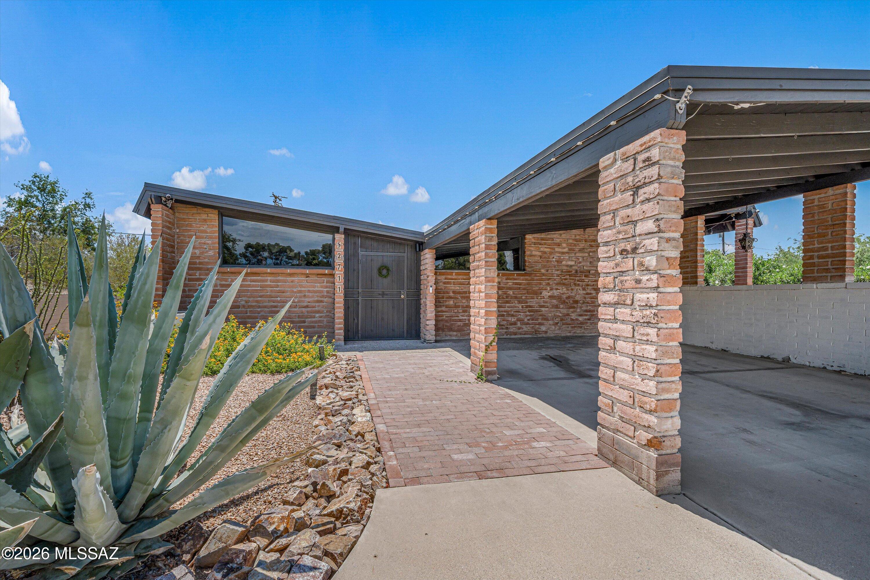 Historic Indian Ridge charm meets thoughtfully updated modern style in this beautifully improved home. Enjoy the discounted tax rate and extensive high-quality upgrades throughout. The primary suite features a contemporary design bathroom with soaking tub and dual vanity. The kitchen offers a gas range, French-door refrigerator, built-in drawer microwave, integrated two-drawer dishwasher, coffee bar, plus a separate cocktail bar with wine fridge and kegerator. Andersen sliding doors and windows frame mountain views. The home has two HVAC units with smart thermostats and extended ductwork, PEX plumbing, new electrical wiring, and an improved roof. Relax in the heated pebble-finish pool and spa with motorized cover, plus enjoy new landscaping, irrigation, and a new powered Tuff Shed!