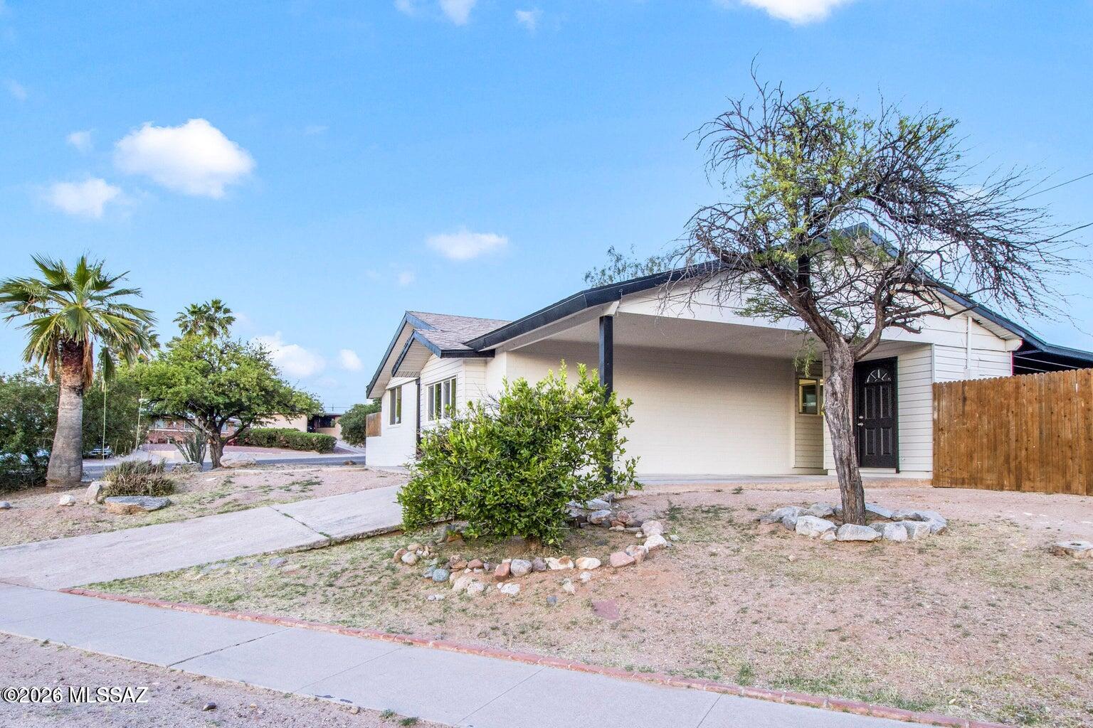 This fully remodeled 2-bedroom, 2-bath property is located in the desirable Tucson area. Situated on a corner lot, this home offers plenty of space and privacy. With 958 square feet of living space, this property is bright and airy, creating a welcoming atmosphere. The open concept design allows for seamless flow between the living, dining, and kitchen areas, making it perfect for entertaining guests. The remodel includes modern finishes and updates throughout, ensuring a contemporary and stylish living experience.