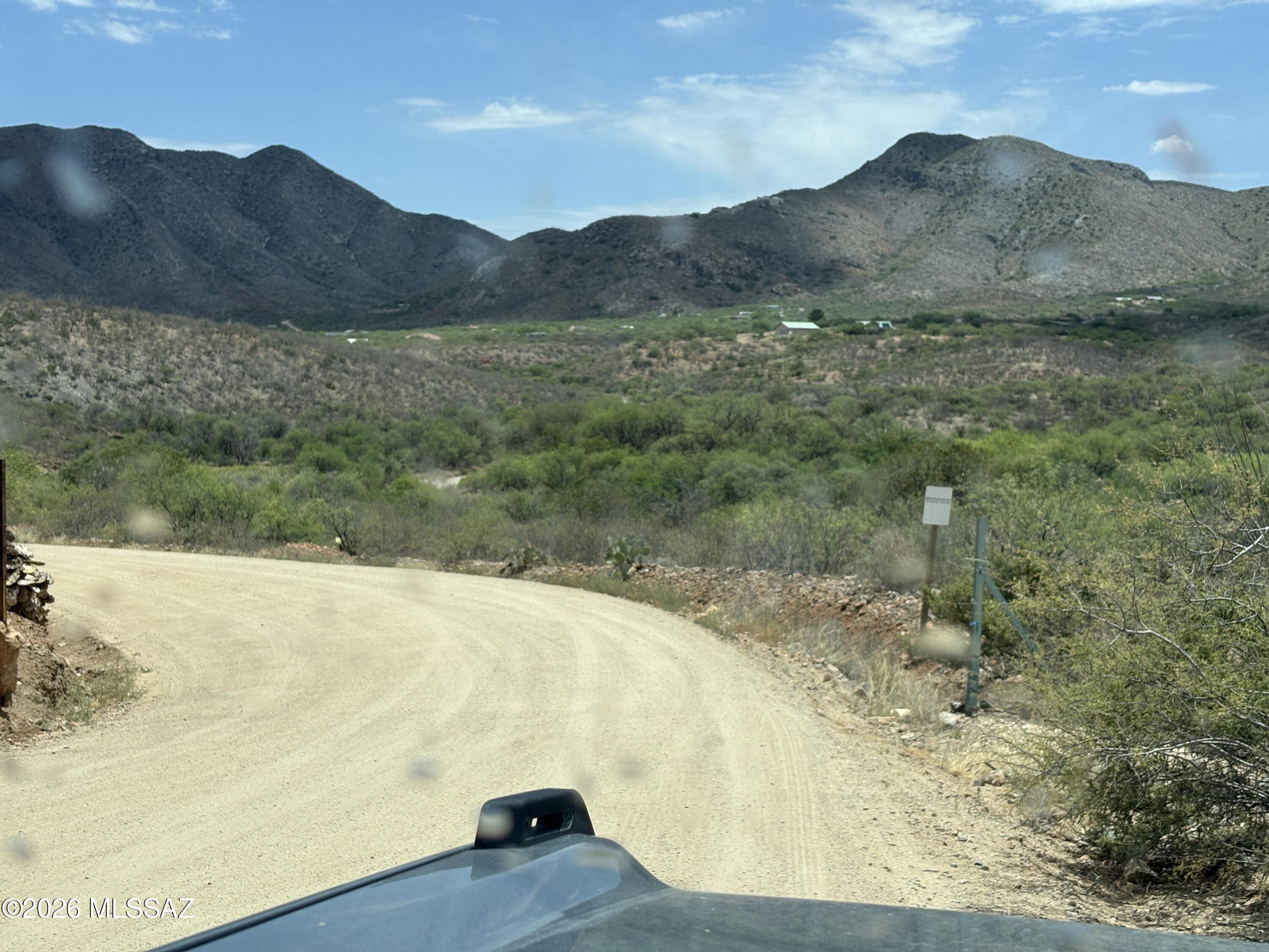 4.13 acre building lot  in rural Vail - large wash breaks the lot into two sections - plenty of building envelope in each area - electrical pole in SW corner. - corner lot - nice natural grown - needs some cleanup.  Great homestead in a rural area - great price, too