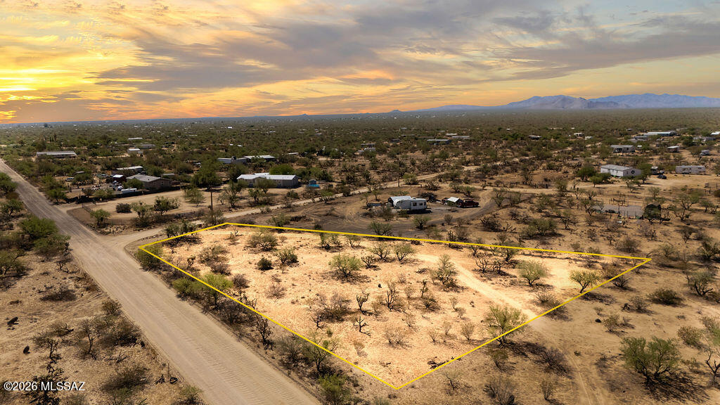 Buildable flat lot that offers freedom to live how you like. No HOA and only 30 minutes to the conveniences and shopping of Tucson. Three Points offers numerous conveniences such as the Three Points General Store, Ace Hardware, Chevron Gas Station, an Animal Feed Store, Tire Shop and more. There is also a public park nearby with a playground, large grass field along with basketball courts and a baseball field. Enjoy the peace and quiet of country living while enjoying spectacular sunsets and star gazing all at a great price!