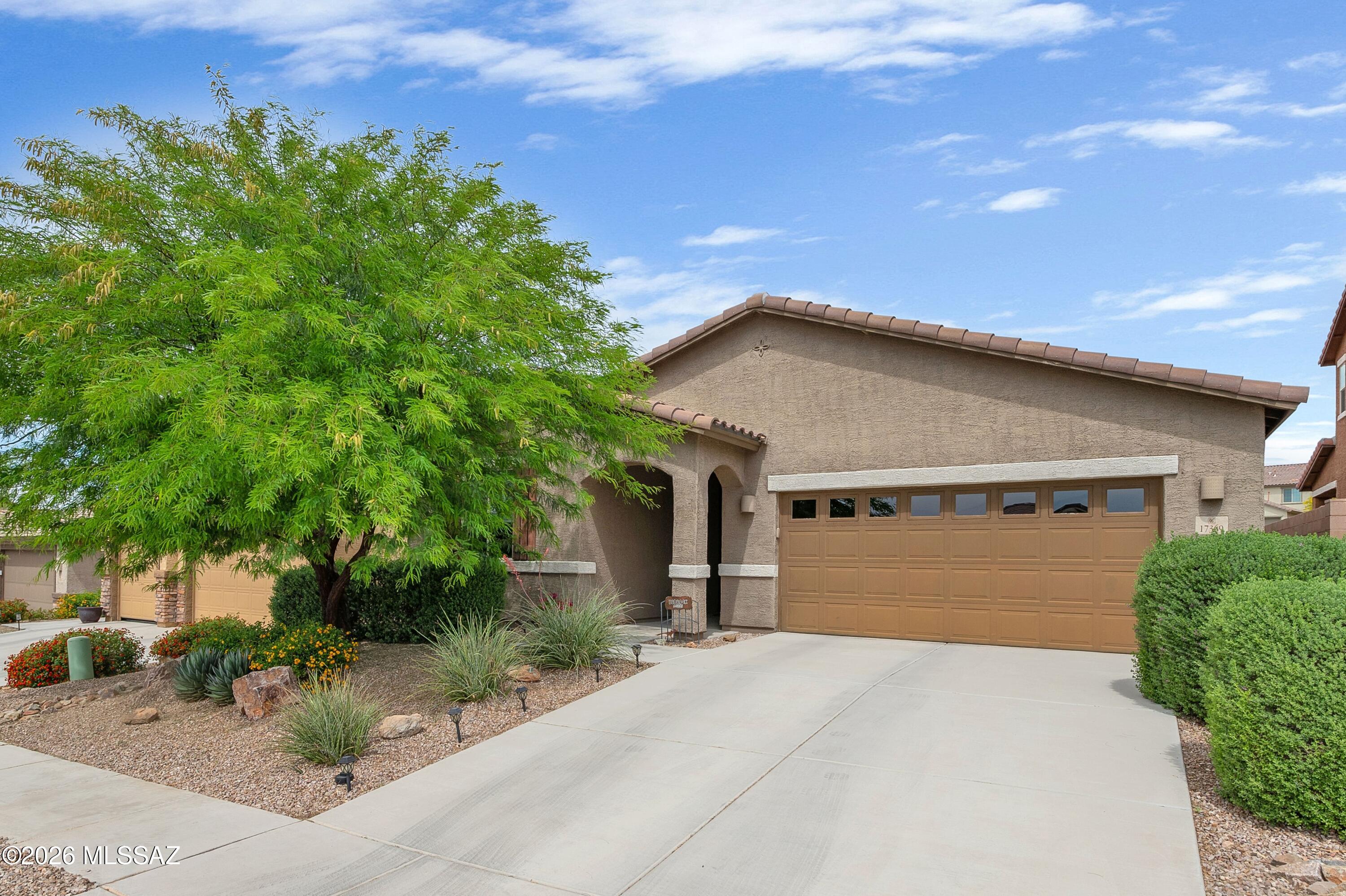 Impeccably maintained and thoughtfully designed, this home offers a highly functional open floorplan with neutral finishes that create a bright, inviting atmosphere throughout! The spacious kitchen features a large island, quartz countertops, and stainless-steel appliances--perfect for everyday living and entertaining. A versatile den provides flexible space for an office, playroom, or additional living area. The split bedroom layout adds privacy, with a generous primary suite including a walk-in closet and en-suite bath. Enjoy the covered patio overlooking a beautifully landscaped backyard with a wrought iron fence and peaceful views of the common area beyond. You don't want to miss this one, schedule your showing today before it's too late!