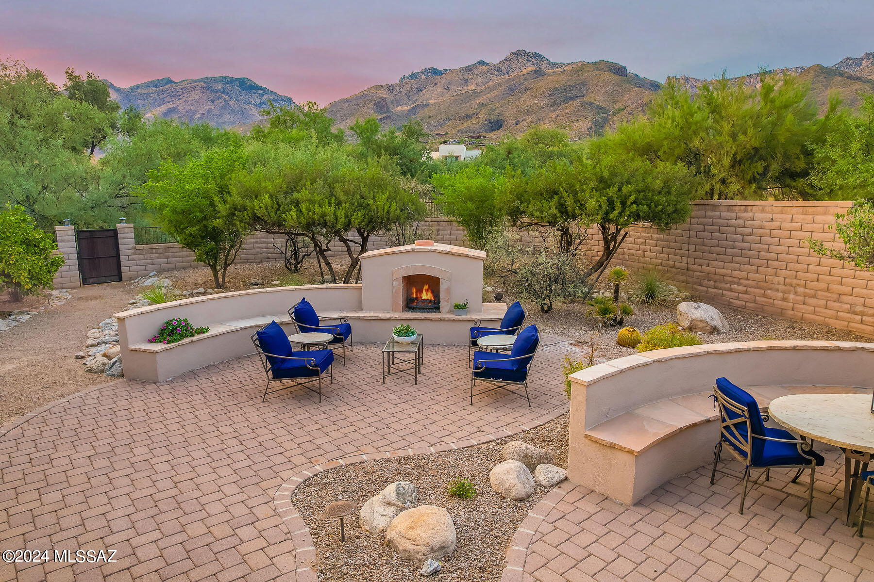 Spectacular home in gated Ventana Reserve. Unobstructed mountain views. Professionally landscaped backyard with fireplace and built in BBQ. Paver driveway leads to a private courtyard entry. The home is all on 1 level with no steps and an open floorplan. Chefs kitchen with all new appliances including Induction stove, stunning granite, custom cabinets, a butlers pantry & a planning desk. Wet bar with wine chiller. All bedrooms are en-suite including a separate casita. Primary bedroom features 2 enormous closets, a sitting area, jetted tub and snail shower. Greatroom is truly great with high ceilings, crown molding, fireplace and big mtn views. Spacious den.  Plantation shutters throughout. Small friendly gated enclave near Ventana Canyon. Perfect for entertaining, a family or lock and go.