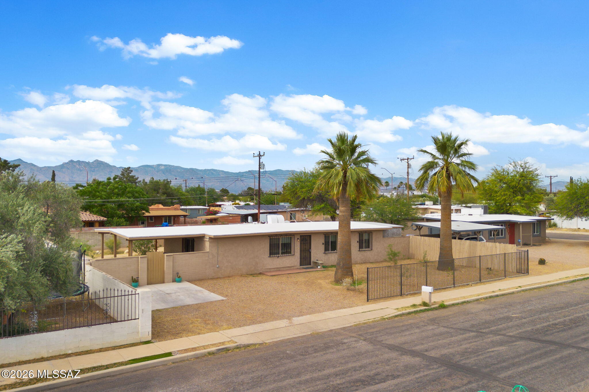 Welcome to this beautifully updated mid century 3 bedrooms, 2 bath home with 1,232 sq ft of well designed space. Located in the heart of Tucson, this inviting residence blends classic character with modern comfort, offering a warm, functional layout perfect for everyday living. Step inside to a bright, welcoming interior where the living area flows easily into the kitchen and dining spaces. The kitchen is complete with updated cabinetry, modern appliances, and a practical layout ideal for cooking and entertaining. The home's bedrooms are well sized, offering flexibility for a guest room, home office, or creative space.
The backyard is open and inviting, offering plenty of room to relax, entertain, or customize and with NO HOA, you have the freedom to personalize the space to your lifestyl And above ground hot tub conveys with the home, giving buyers a ready made retreat for unwinding under the Arizona sky. The yard also includes a built in storage room, perfect for tools, hobbies, or seasonal items. Laundry is conveniently located in its own separate backyard access room, keeping noise out of the main living areas while adding extra functionality. 
Located minutes from Reid Park, shopping, restaurants, and major employers, this home delivers convenience and comfort in one of Tucson's most accessible central neighborhoods. This home blends comfort and the space flexibility that today's buyers are looking for.