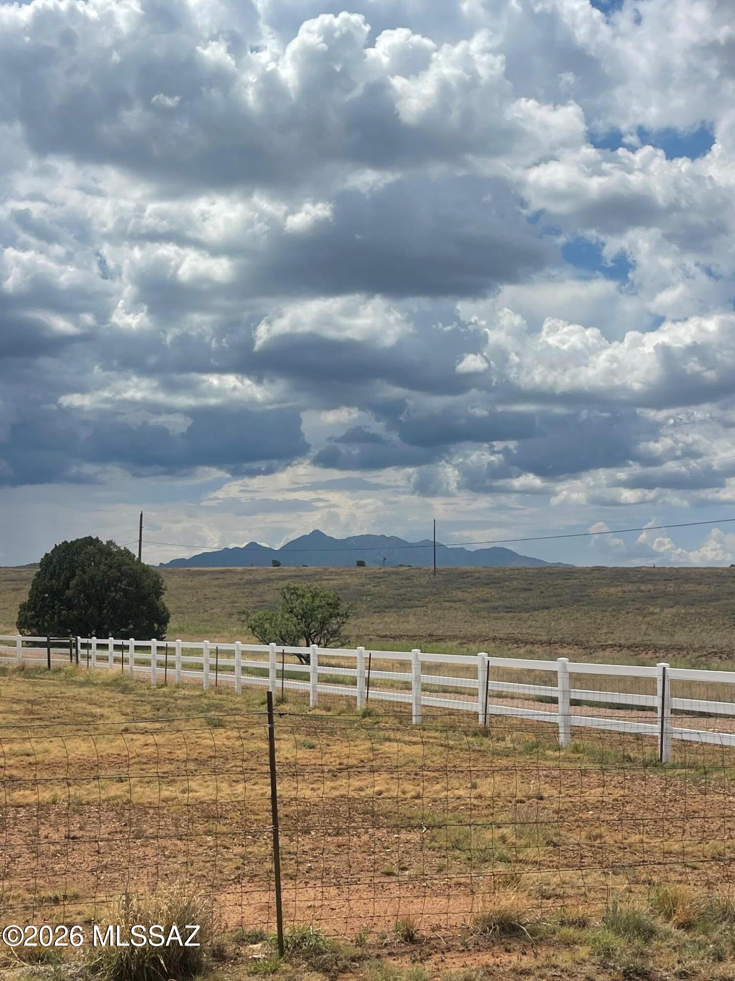 High ground lot with a easy roll to it, fenced on 3 sides, one lone juniper trees on these 4.7 acres. Grassy buildable lot with Mountain views. power close by. The zoning will allow for a house, guest house and barn. About 5.5 miles from the cross roads of Hwy 82/ 83 Approx 25 miles to Parker Lake.
