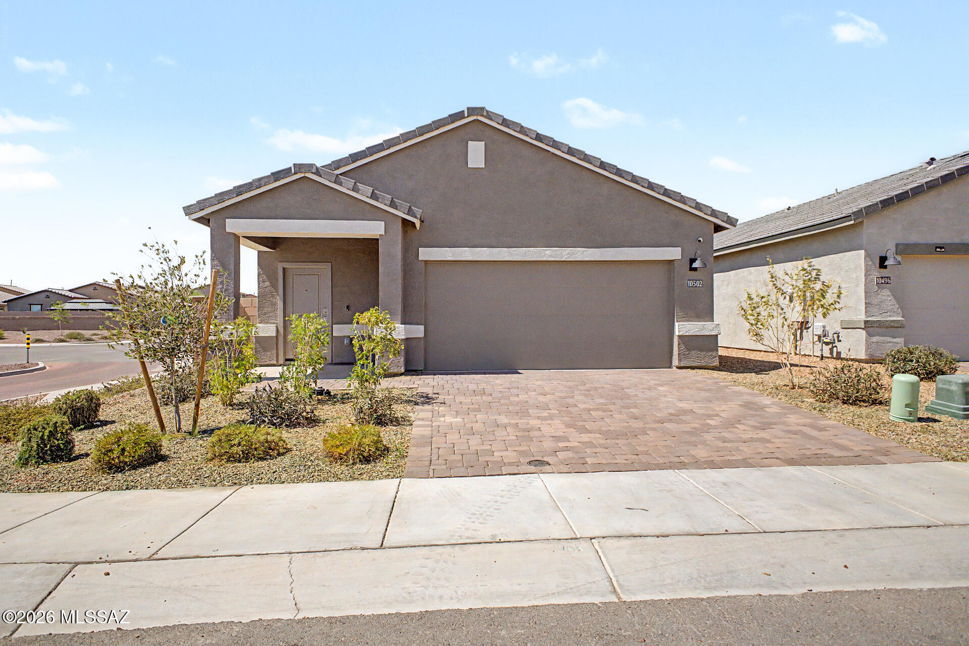VA ASSUMABLE LOAN at 4.99% and solar panels to help reduce monthly electric costs! This beautifully maintained 4-bedroom, 2-bath home sits on a desirable corner lot and features an open-concept layout with high ceilings, recessed lighting, wood-look flooring, and sliding glass doors for seamless indoor-outdoor living. The kitchen offers solid surface countertops, 42'' gray shaker cabinets, stainless steel appliances, a pantry, and a large island with breakfast bar. The spacious primary suite includes dual sinks and a walk-in closet. Relax under the covered patio and enjoy all the community amenities, including pools, spa, fitness center, parks, and recreation areas. A must-see home offering comfort, value, and affordability!