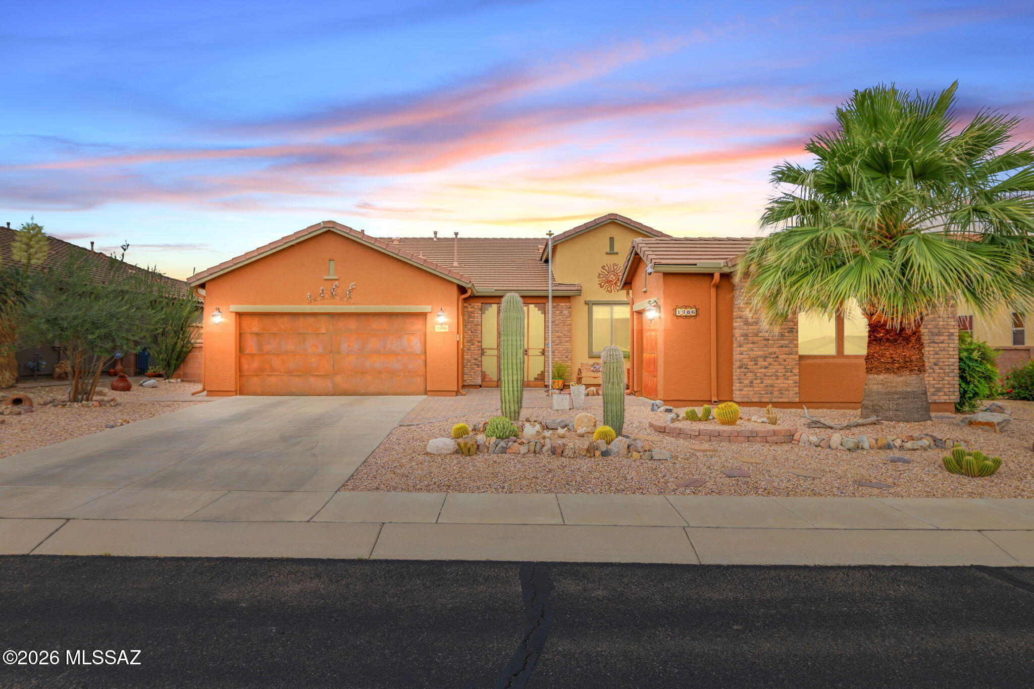 Amazing opportunity for updated 2,987 SqFt 3 bed/2.5 bath split floor plan with den and flex room, single story w/no stairs/no steps, 2009 built modern contemporary home on premium .22 acre elevated view lot featuring unobstructed panoramic Sonoran desert and Santa Rita mountain views, seller owned solar photovoltaic panels, heated pool, 633 SqFt attached 3 car finished garages located in the desirable gated community of Madera Highlands Encore. Featuring NE/SE orientation, mountain views, no neighbors in front or behind, modern flat concrete tile roof, concrete driveway, concrete sidewalks, freshly painted outside ($6500), on and off-street parking, landscaped manicured front yard w/crushed rock, Saguaro cactus, fruitless olive and palm trees, custom rustic garage doors, metal gutters, concrete walking path to secure gated enclosed front patio. Inside enjoy tall textured ceilings (no popcorn), energy efficient double pane windows, new custom matching blinds, solar window screens, luxury plank and tile flooring throughout (no carpet), built-in ceiling fire sprinkler suppression system, crisp white 8' internal doors, ADT alarm installed, zoned gas Trane HVAC system (new 2023 $27K),  dual digital Smart thermostats, Pex plumbing (no polybutene), plumbed whole home water filtration Green water softener & carbon filter system (new 2024 $3200), recessed lighting, luminated ceiling fans and formal dining area. Entertainer's dream open concept kitchen featuring full slab granite counter tops, matching massive full slab granite island with bar seating, self-closing designer staggered modern kitchen cabinets with lower cabinet pull-out shelves, stainless steel appliance package, convection oven, brick backsplash, butlers pantry with walk-in closet, laundry room with exhaust fan, washer and dryer included, adjacent to spacious great room with fantastic natural light, built-in 4 speaker surround sound and gas fireplace. Endless possibilities for the attached enclosed West facing tiled flex room, currently used as a home gym, with remote control outside electric powered shades. Large primary suite with full ensuite bathroom featuring dual walk-in closets, separate soaking tub, walk-in shower and matching dual executive height cultured marble modern vanities.
Attached 633 SqFt finished 3 car garage with remote controlled garage doors, concrete floors, provide ample room for workshop, toys, golf carts or convert a stall to home gym.
Epic Tucson sunsets await from your private backyard retreat with open wash and no neighbors behind, providing 180° unobstructed Santa Rita mountain views! Relax in your sparkling heated pool year-round, soothing waterfall, new electric pool heater ($3824 in 2023), cartridge pool filter, variable speed pool pump, raised flower beds, orange and lime trees, Tuff shed storage, Belgard brick pavers, plumbed for gas grills, ramada, side gates, view fencing surrounded by HOA approved raised privacy block walls. 
Affordable $117 monthly HOA includes secure gated entrance, community pool, basketball courts, tennis courts, grassy park, extensive paved walking paths, street and common area maintenance. Call to make your appointment to view this gorgeous move in ready home today!