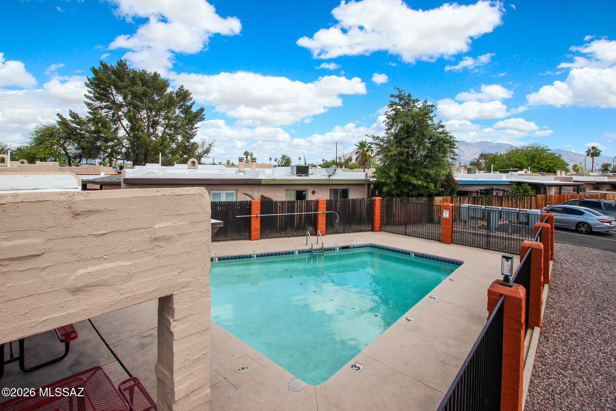 Experience comfortable living in this move-in-ready 2-bed, 1-bath townhome in central Tucson.  Explore two well-sized bedrooms with generous closet space. The primary bedroom opens through a French glass door to a covered patio, creating an easy indoor - outdoor flow. Conveniently located near shopping, dining, and entertainment. The community offers a refreshing pool perfect for enjoying Tucson's sunny days.
