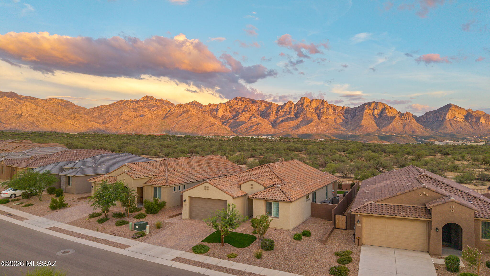 Immaculate home now available in Gated Vistoso Canyon Estates on front row of homes with incredible Catalina Mountain Views out the back!  Built by Pulte in 2024, Single owner, one story, 2 bedroom split plan, plus Den, & 2 full bathrooms. This home is been well cared for so take advantage of owning a newer home with landscaping & window treatments already available.  Open floor plan, light and bright.  Kitchen with stainless appliances, Quartz countertops, Gas cooktop & vent, kitchen open to the living room & massive views to the mountain range.  Separate laundry room with ample storage, 2.5 car garage 220 for elec car & storage, instant hot water heater and large backyard with turf, fire-it and room for pool if desired.  Perfect for a full time resident or a winter visitor lock & leave