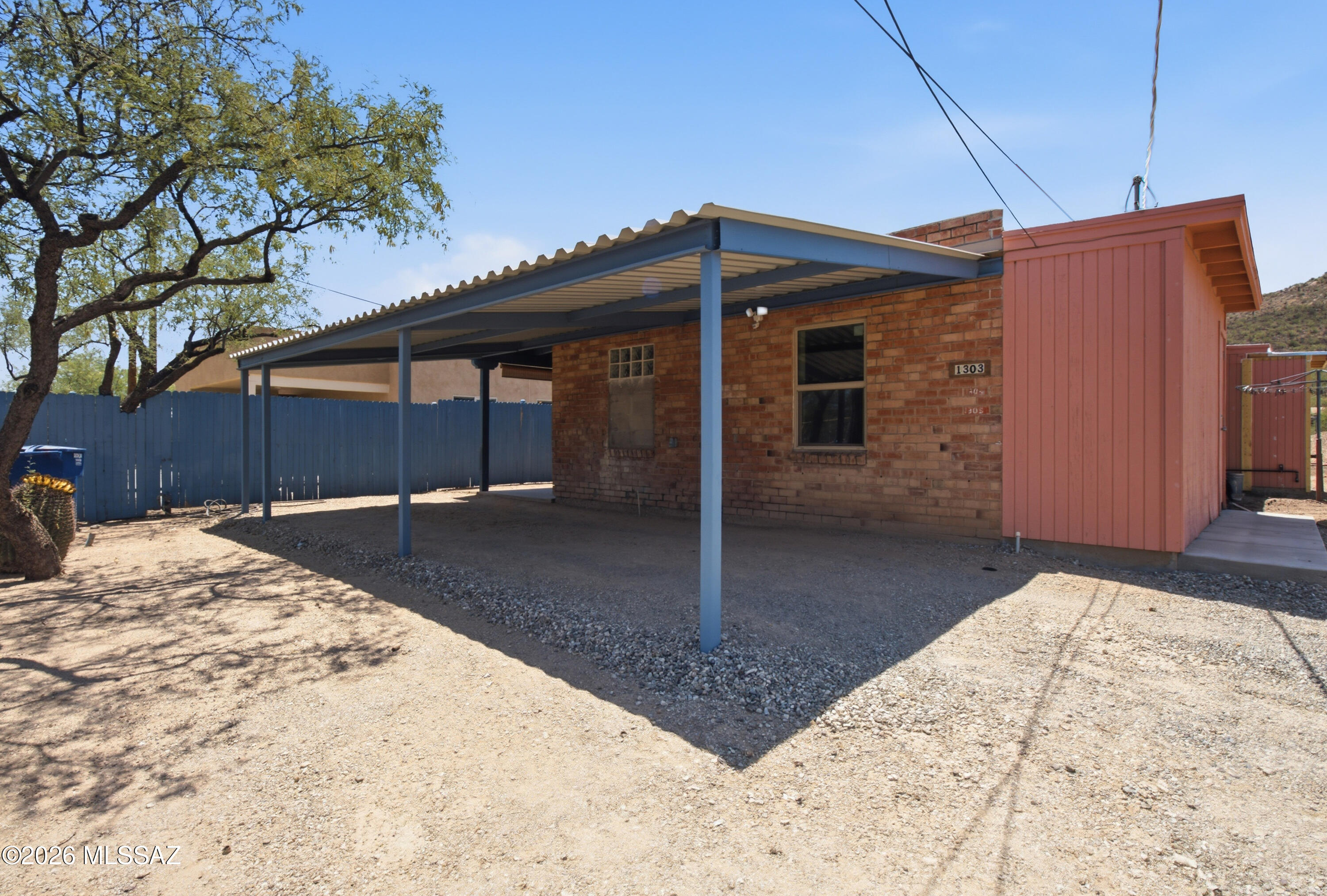 Welcome home to this charming 1-bedroom, 1-bathroom single-story home on Tucson's desirable west side! This bright, move-in-ready home features easy-to-maintain tile flooring throughout and a spacious kitchen with stainless steel appliances, ample cabinet space, and plenty of natural light. Enjoy the convenience of covered parking and a private outdoor storage area. Ideally located just minutes from Downtown Tucson, I-10, shopping, dining, hiking trails, and the University of Arizona, this home offers the perfect combination of comfort and convenience in a great location. Don't miss your opportunity to make this inviting home yours!