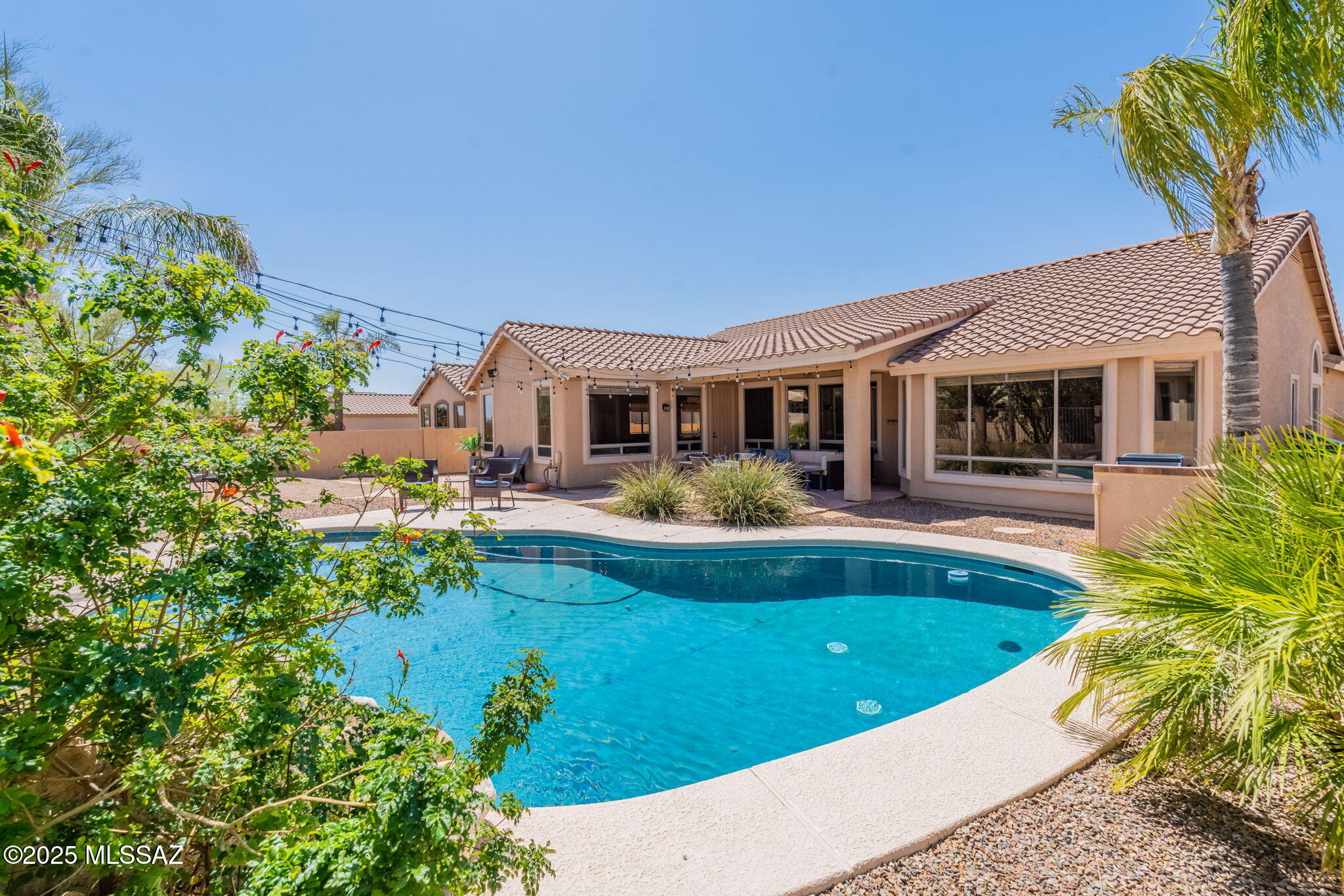 UNFURNISHED SPOTLESS SINGLE-LEVEL 4-Bedroom/2-Bath home in the heart of Oro Valley- walking distance to the bagel shop and lots more! THREE CAR GARAGE, East-facing Rear Patio WITH BBQ AND SWIMMING POOL! Kitchen features Stainless Appliances, Granite Counters. Concrete FLOORS! Newer HVAC, Need a place while you're searching for your next home? Or doing a major remodel? Building New Construction? WE DO FLEXIBLE LEASES to coordinate with your construction timeline and needs. Photos show furniture to give you the feel of the property, but this is offered as an UNFURNISHED RENTAL HOME.
Contact Listing Broker for your personal tour today!