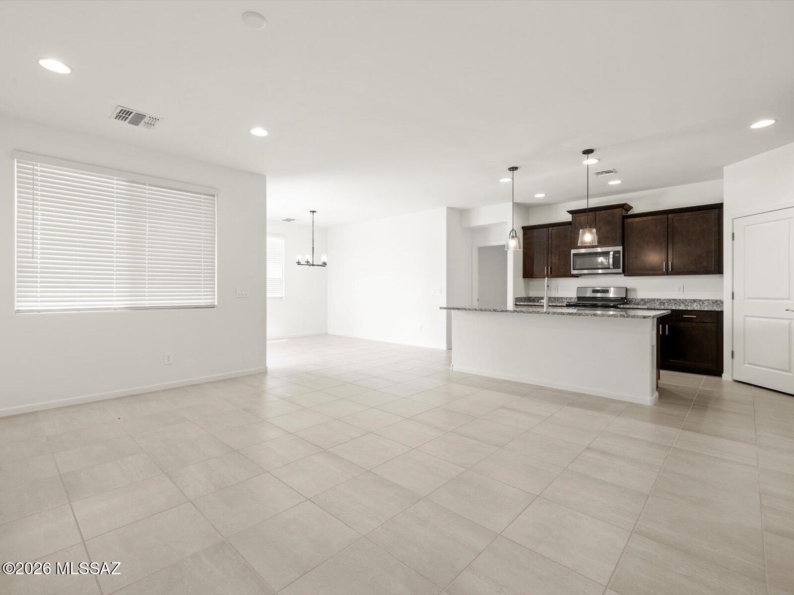 Spacious and inviting, this four-bedroom home features an oversized great room--perfect for game days or cozy movie nights. The private primary suite is tucked away, offering a quiet retreat from the rest of the home, while additional bedrooms provide plenty of space for guests.
Located in the sought-after Mandarina community in Marana, AZ, residents will enjoy planned amenities including a pool, pickleball courts, parks, and a dog park. Move-in ready with a washer, dryer, refrigerator, and whole-home blinds, plus energy-efficient features designed for comfort, savings, and everyday peace of mind.