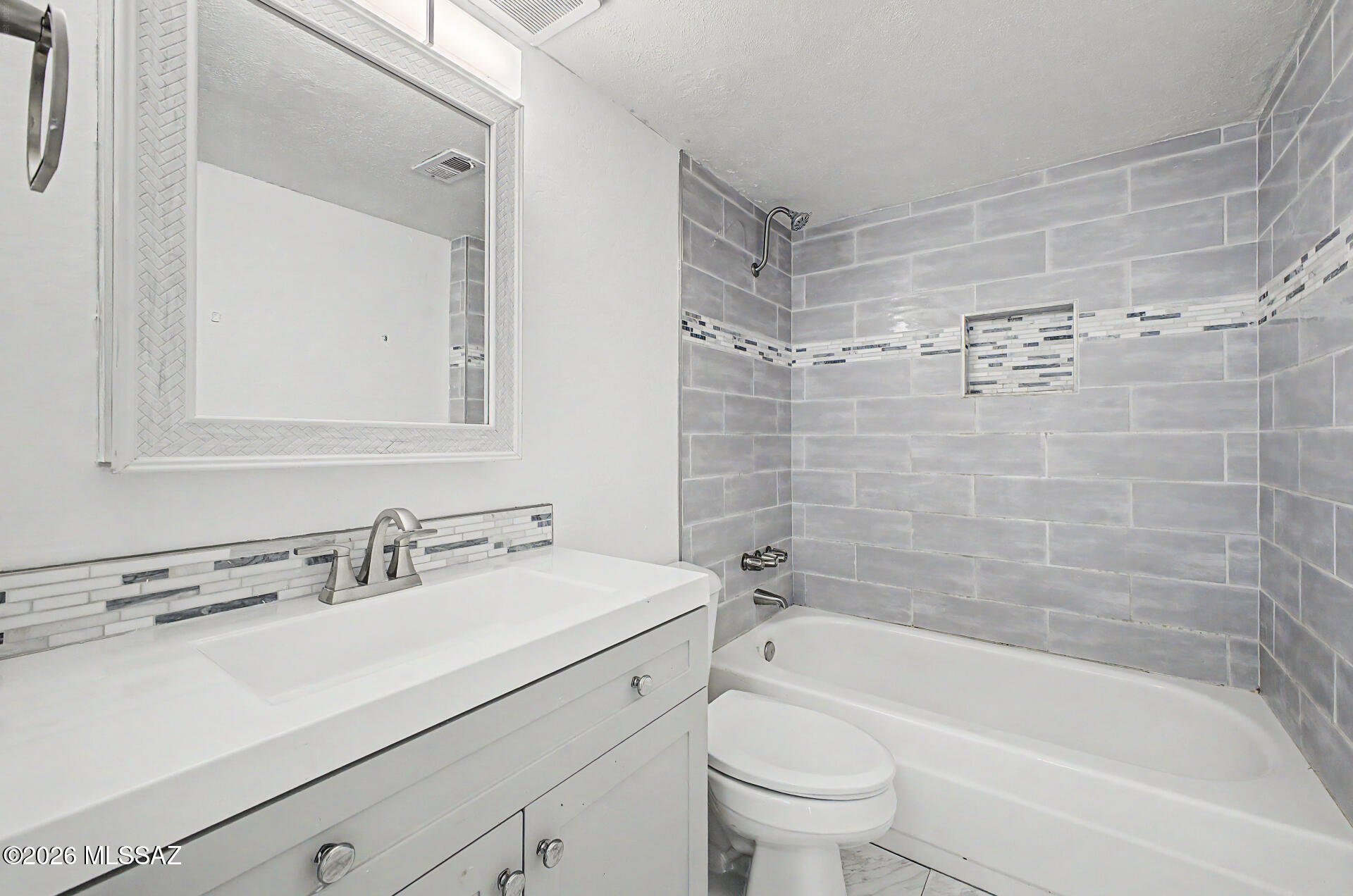Fantastic opportunity to own this ground-level 3-bedroom, 2-bath condo unit with fresh paint and carpet! Discover a cozy living room with a soothing palette, plush carpeting, and an inviting wood burning fireplace. The well-appointed kitchen includes wood cabinetry, a tile backsplash, and essential built-in appliances for a seamless cooking experience. The cozy primary bedroom features abundant natural light, a private bathroom with a tiled shower, and a practical walk-in closet for an organized wardrobe. Unit also has its own interior washer and dryer for convenience Unwind at the end of a long day on the private enclosed covered patio. The Community boasts a refreshing pool, a recreation center, and a convenient location close to bus stops, restaurants, and shopping. Don't miss out on this lovely home!