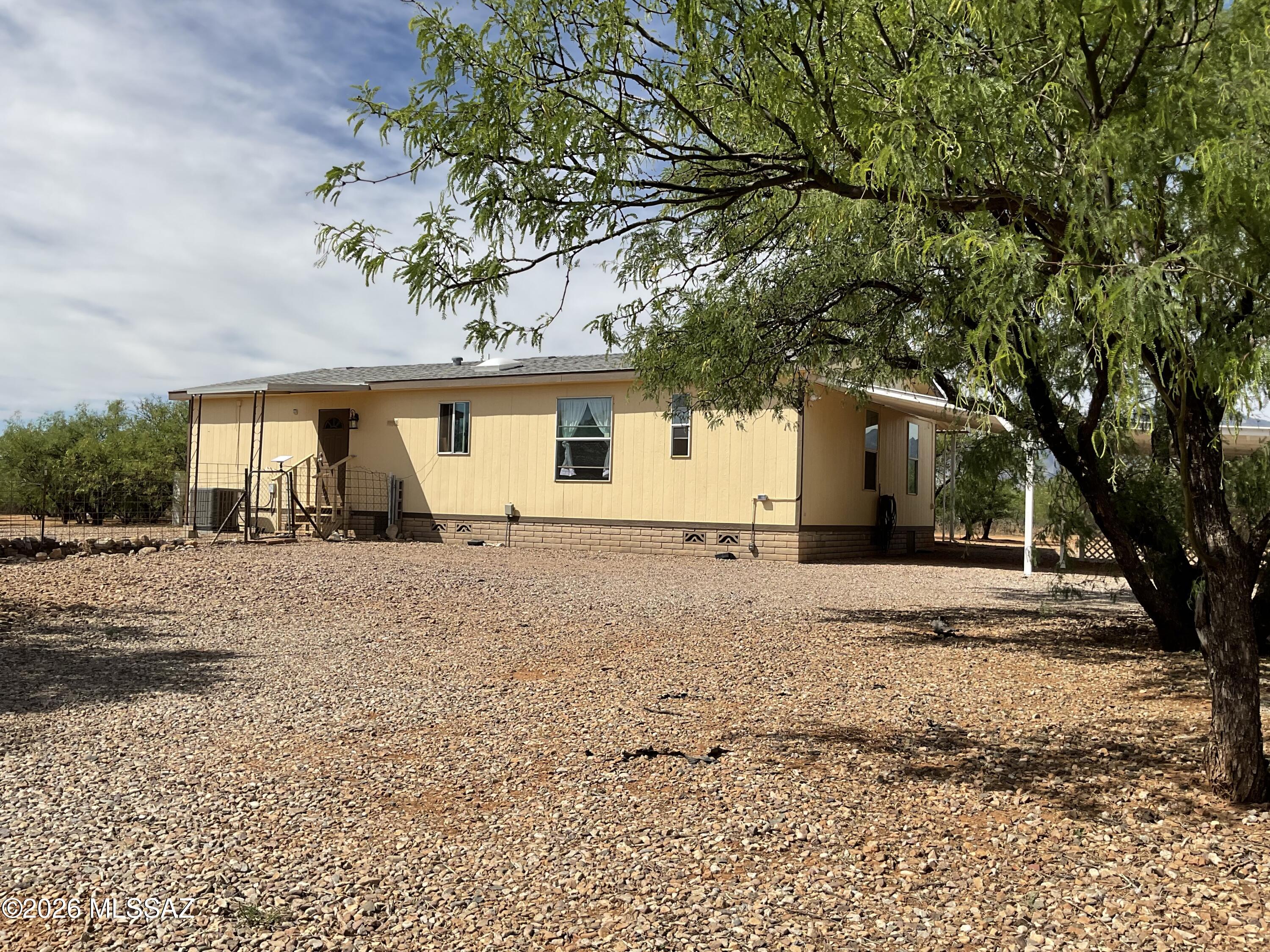 Home is located on the center of 4-acres. The home is well hidden by indigenous plant live and has 360 view of the surrounding mountain ranges (Huachuca's, Dragoon, Mule Mountains) and view of the San Pedro River valley. Lots has plenty of available land to create a small ranch, fields of gardens. Property entirely fenced-in.