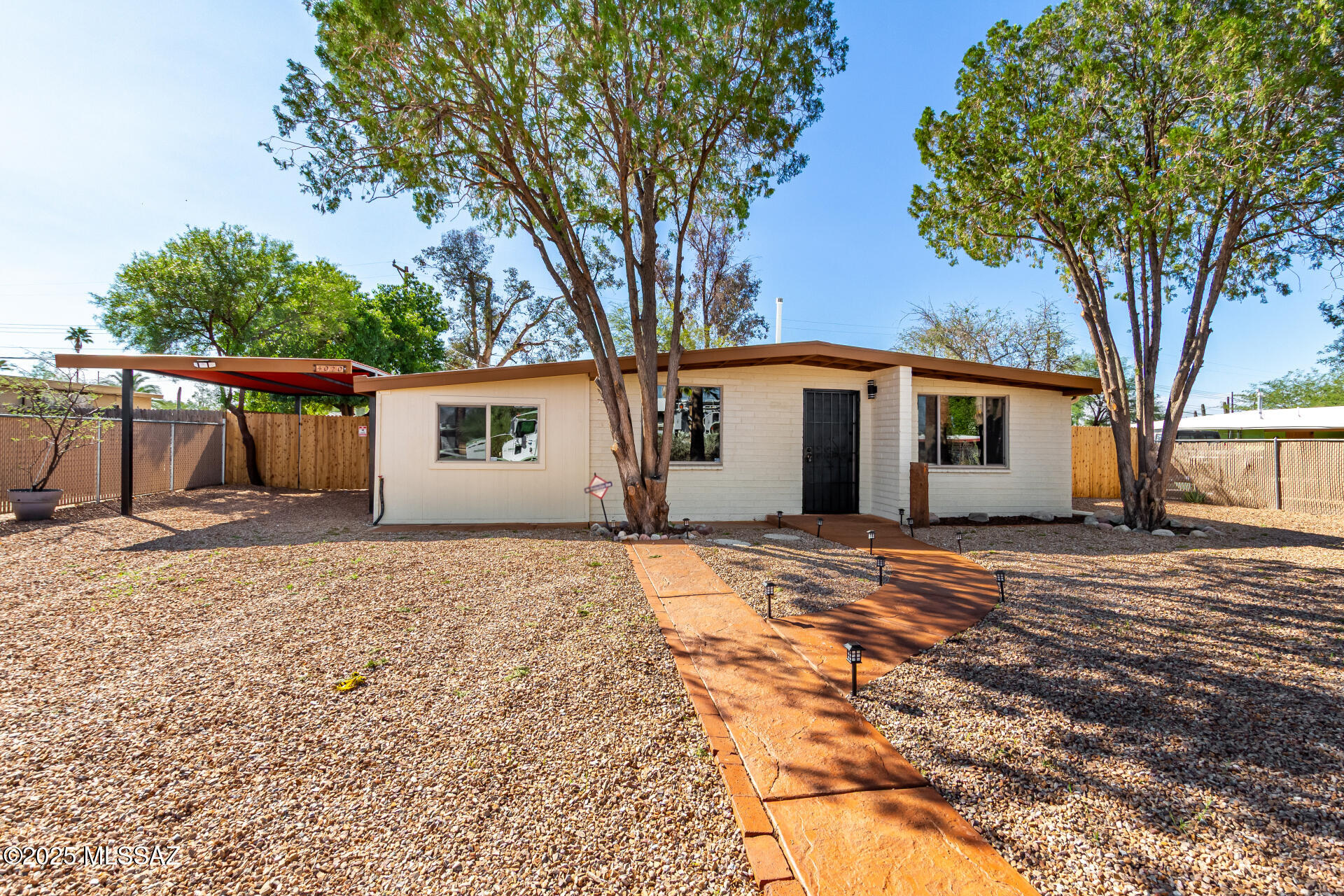 Welcome to this thoughtfully renovated residence! You're greeted by a practical carport for secure parking and a low-maintenance front yard. Inside, you'll find an upgraded interior featuring a living room with vaulted ceilings, recessed lighting, a soothing palette, blinds, and stylish wood-look flooring. You'll also find a well-appointed family room for relaxing evenings with loved ones. The updated kitchen comes with granite counters, crisp white shaker cabinets with crown moulding, a tile backsplash, and sleek stainless steel appliances. The primary bedroom showcases a cozy sitting room and a private bathroom for added comfort. Imagine quiet afternoons in the backyard, which offers a paver patio and a shed for additional storage. Don't miss this revitalized home! Owner/Agent