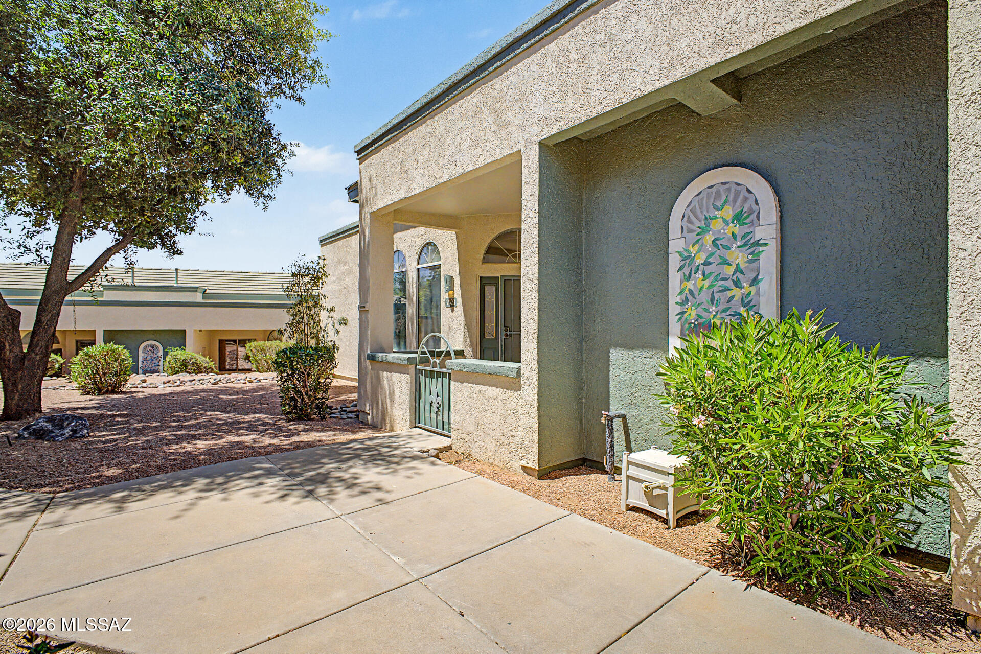 Discover the perfect blend of comfort & convenience in this delightful 2-bed, 2-bath townhome, nestled in a quiet & private location where the outside world softens into birdsong & rusting leaves within the sought-after NW 55+ gated community of Mona Lisa Village. This home is move-in ready and built for worry-free living.  No carpeting to worry about. Roof 2024. Located across the Clubhouse, Pool & Spa.   The HOA takes care of water, sewer, trash removal, exterior maintenance & gated security, leaving you free to relax & enjoy your surroundings.  Community is close to Restaurants, Shops, Ann Day Community Park, Dog Park, Medical facilities, Short Distance to Pima Community College NW campus, the YMCA, Bike loop & I-10