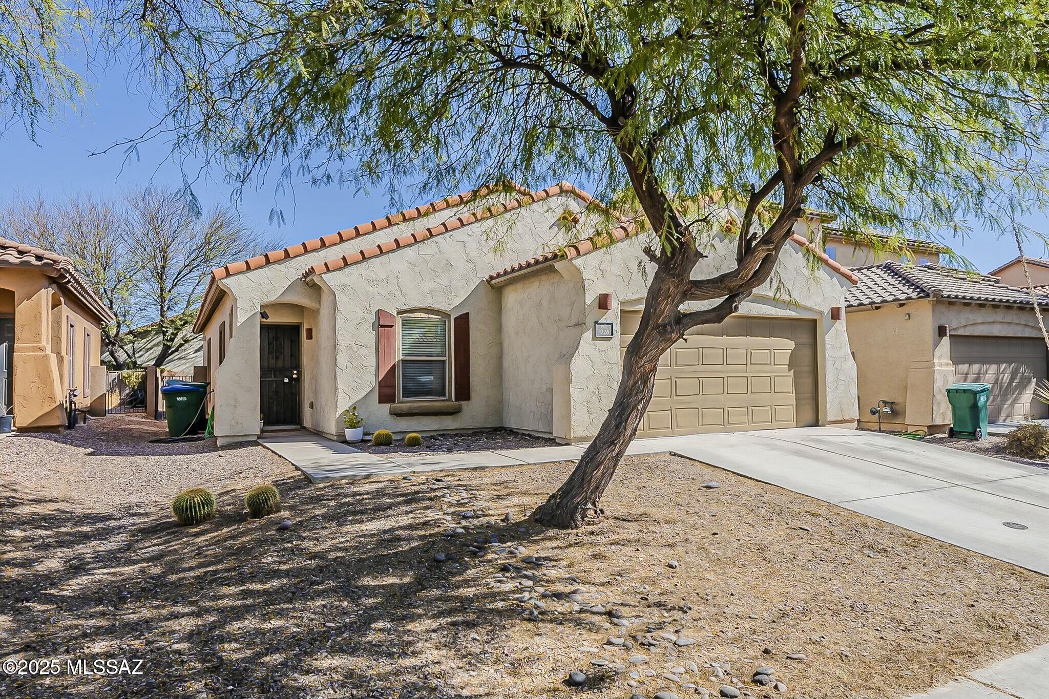 Spacious single-story 4 bedroom, 2 bath Pulte home in the highly desirable Rancho Sahuarita community! This open-concept floorplan offers abundant natural light, a large kitchen with ample counter space, and a convenient kitchen pantry--perfect for everyday living and entertaining. The generously sized primary suite provides a comfortable retreat. Enjoy Arizona evenings under the covered patio in your private backyard.
Located in Rancho Sahuarita with access to resort-style amenities including a lake, water park, multiple pools, clubhouse, fitness center, parks, and walking trails. Move-in ready and ideal for comfortable Arizona living!