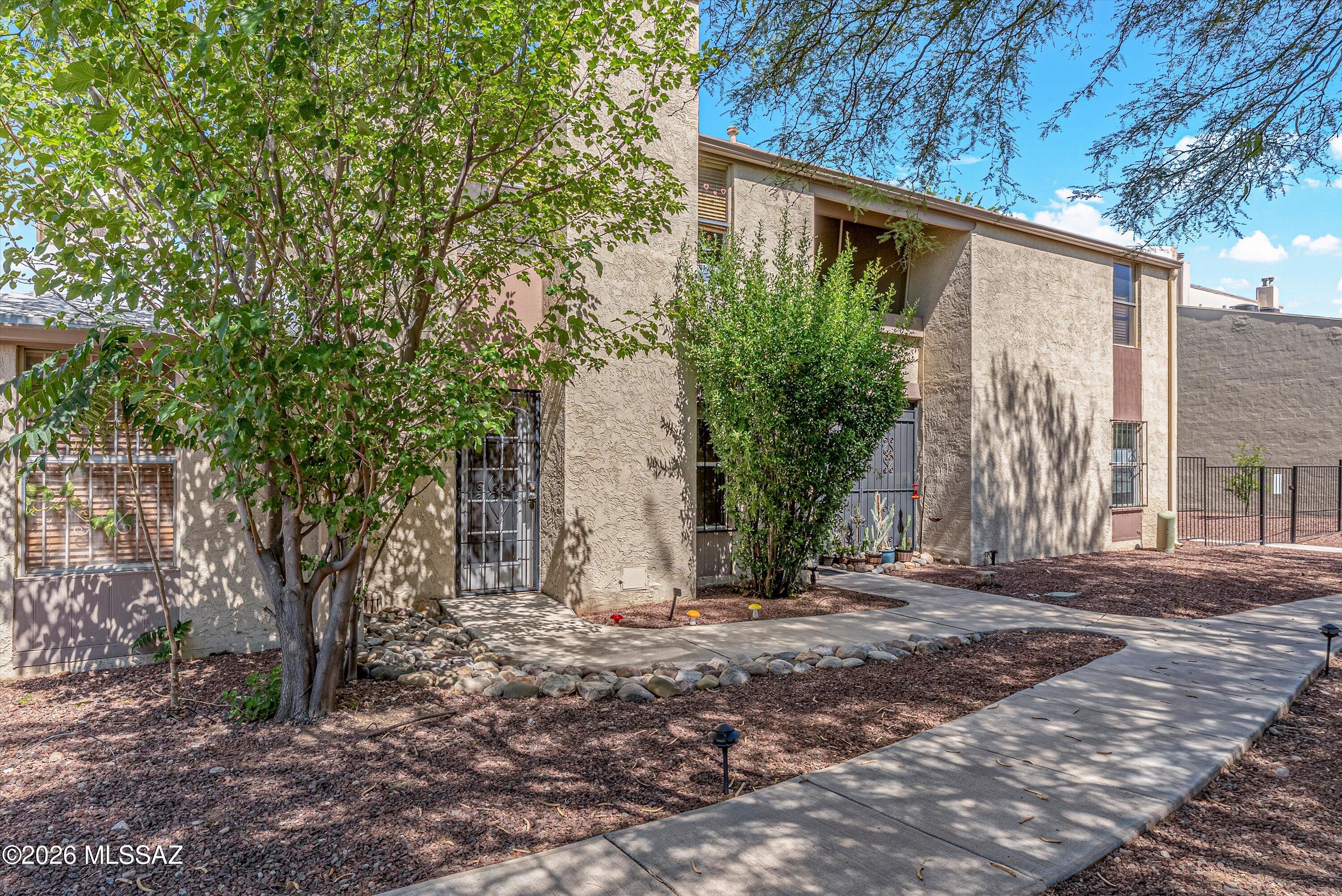 Move-In Ready Condo in Desirable Pima Park - Riverview Condos!

Welcome home to this beautiful and bright 2 Bed/2Bath 1105sq ft condo located nearly at the end of Country Club Road! Thoughtful upgrades in recent years include refreshed kitchen cabinetry, refrigerator, stove, microwave, washer and dryer, updated tile in both bathrooms, water heater, popcorn removal, smart thermostat and stylish tile flooring throughout the home.

The inviting main living area features an open-concept layout with a breakfast bar, dining area, spacious family room and even a nook great for a desk- highlighted by a cozy wood-burning fireplace. Upstairs, you'll find two generously sized bedrooms, each with direct access to an oversized private balcony- perfect for enjoying Arizona mornings and evenings! Your primary ensuite has Pella French doors with incorporated blinds, a tiled tub surround and a spacious closet. Tons of storage offered by a large linen closet and an additional hallway closet- talk about great use of space.

 Bedroom 2 is equally grand.  Hall bath has a convenient shower with elegant tile surround as well. 

Outside your back door, enjoy meticulously maintained common areas filled with mature landscaping, grass and lush greenery, winding paths and lots of shade. Cool off during the summer months in the sparkling community pool. 

Perfectly situated in central Tucson, this home offers exceptional access to some of the city's most desirable amenities. Walk to the Tucson Racquet Club or enjoy miles of paved paths along The Loop and Rillito River Park. Located across from the historic Winterhaven neighborhood and just minutes from the U of A, Tucson Medical Center, St. Philip's Plaza, Rillito Farmers Market, Trader Joe's, shopping, dining, and entertainment! You'll surely love the convenience and active lifestyle this location provides. 

Additional features include a designated carport, storage room/workshop space and ample guest parking. HOA Fee covers Common Area Maintenance, Exterior Maintenance of Unit, Garbage Collection, Pest Control, Roof Repair; Roof Replacement; Sewer; Street Maintenance and Water!!  This move-in-ready condo offers comfort, convenience, and an exceptional lifestyle in one of Tucson's most desirable areas.
