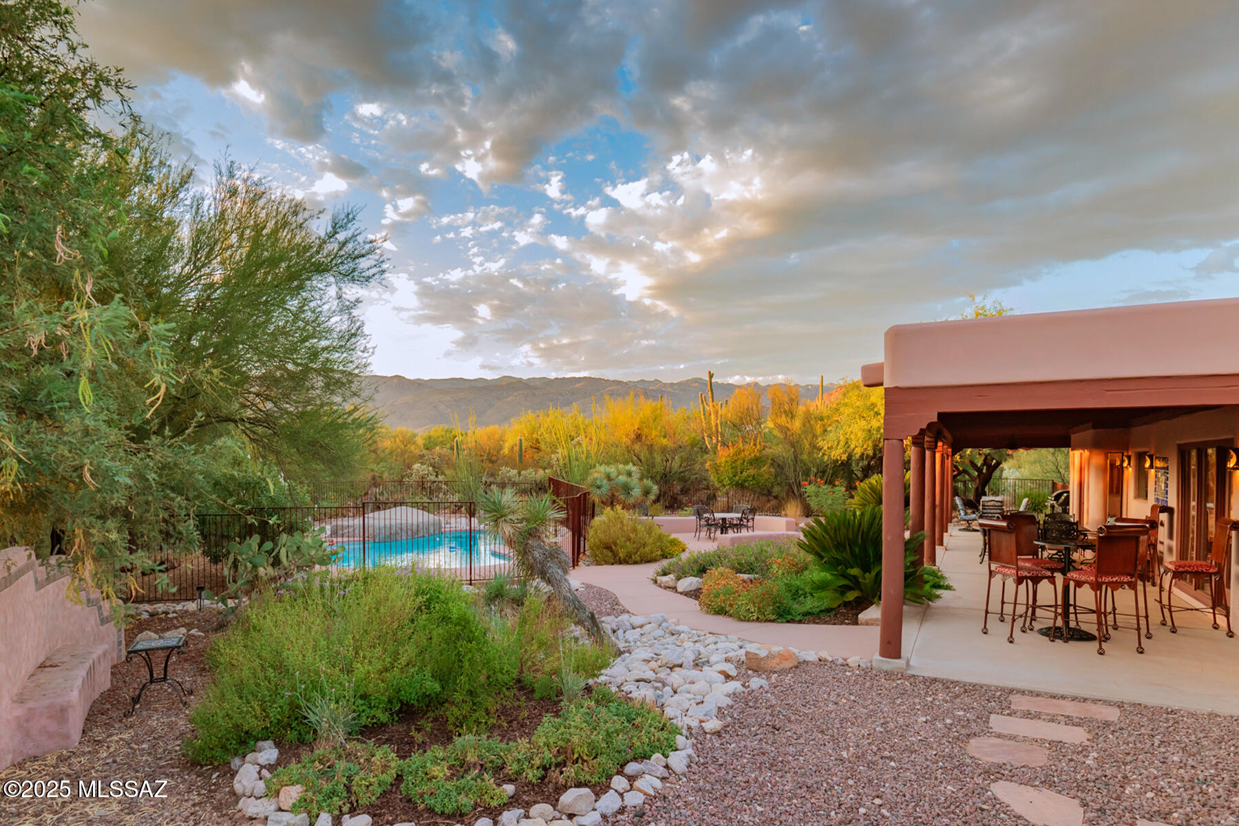 Ever walk into a luxury home and think, ''Wow! I'd LOVE to live here!'' Well, now you can! This secluded, 2837 sq ft luxury property, located on over an acre at the end of the road, is absolutely GORGEOUS! It boasts a newly remodeled kitchen w/Quartz countertops, remodeled  bathroom with Old World Vanity and Jaisalmer counter top, open floor plan with 5 large bedrooms, 3 bathrooms, wall-of-glass primary bedroom overlooks the private backyard and patio with views of the Catalina Mountains and pool. The home has not only one main living room, but a separate and private flex area that can be used as a TV room, office, exercise room and bedroom combination. Luxury at it's finest! This one is a must see! Enjoy!