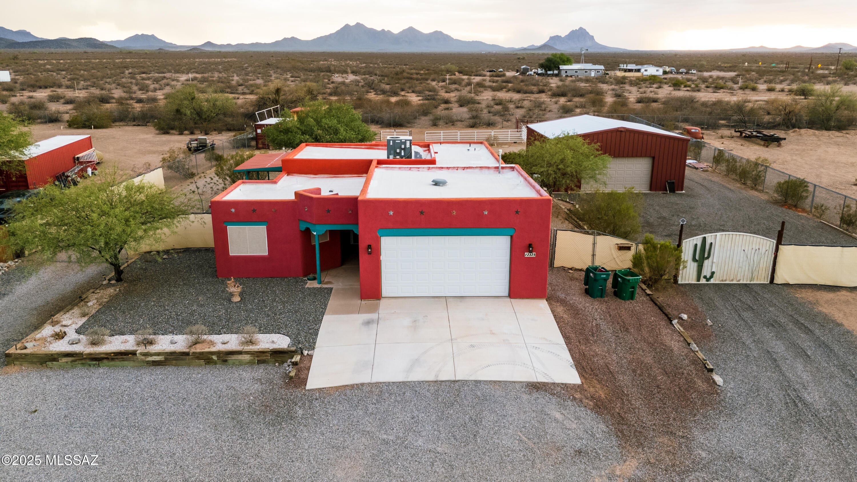 Welcome to your dream horse property in Marana! This beautiful 3 bedroom, 2 bath home sits on just under an acre with plenty of space to spread out. Enjoy stunning mountain views, a large covered patio, and a fully fenced yard with room for horses, trailers, or toys. The 900 sq. ft. detached workshop is insulated and includes a 9-ton 4-post lift, its own heating and cooling system, and is ideal for car enthusiasts or hobbyists. The garage and kitchen are also equipped with their own heating and cooling units for added comfort. The home was painted with elastomeric paint five years ago and again last year. Peaceful desert living with no HOA, yet close to shopping, dining, and I-10 access!