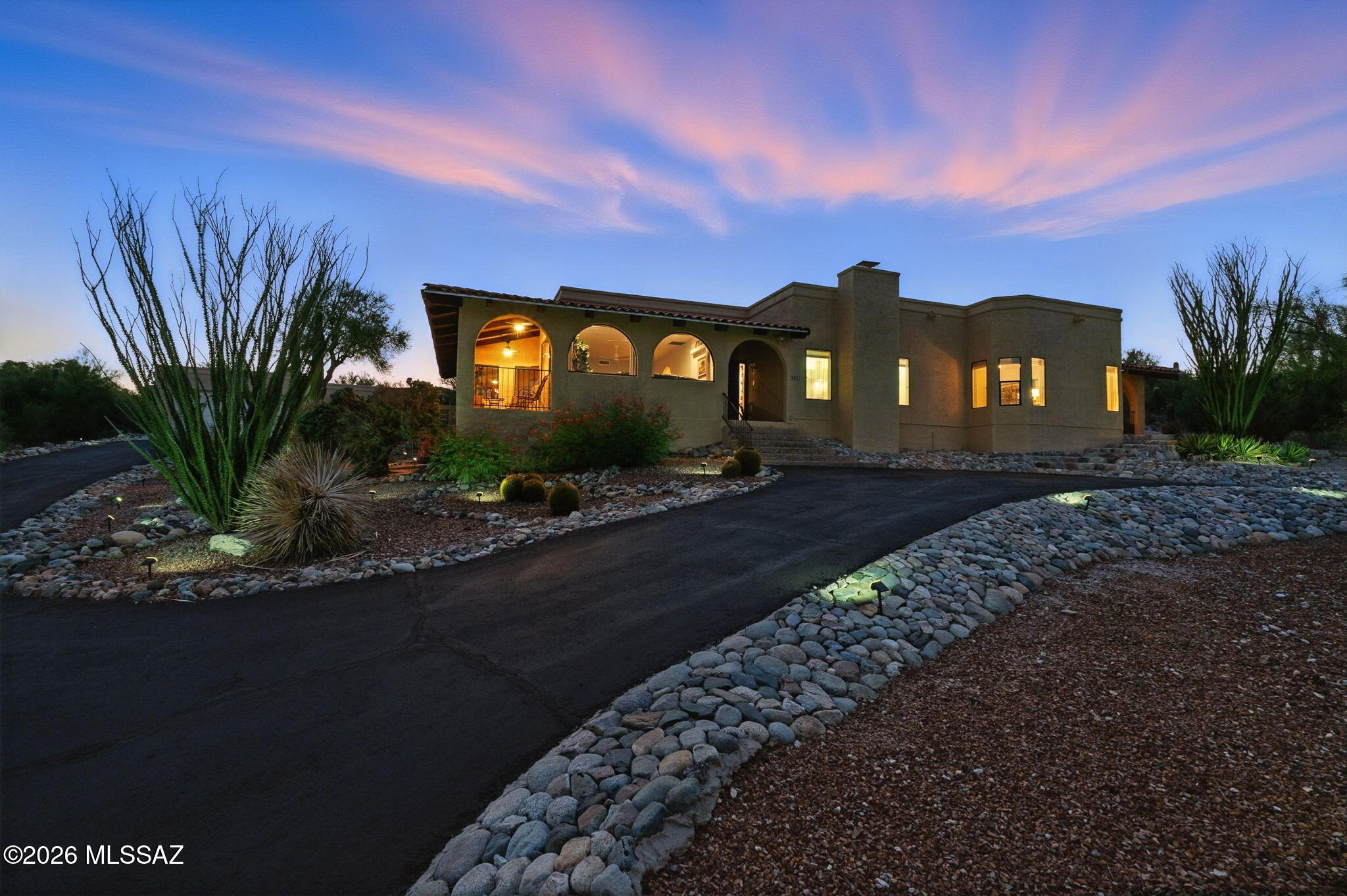Welcome to this stunning 3-bedroom, 3-bath home offering nearly 3,000 sq ft of beautifully designed living space, complete with a 4-car garage & a backyard oasis with a pool you'll never want to leave! Enjoy incredible views with an open-concept layout. The formal living room features a cozy fireplace and elegant archways, complemented by wood-look LVP flooring & modern lighting throughout. The spacious kitchen boasts granite countertops, stainless steel appliances, a breakfast bar with seating.The bright and airy family room opens to a covered patio through a sliding door, seamlessly blending indoor and outdoor living. Retreat to the large primary suite with a private patio and a generous walk-in closet. Located in The Award-Winning Catalina Foothills School District.
