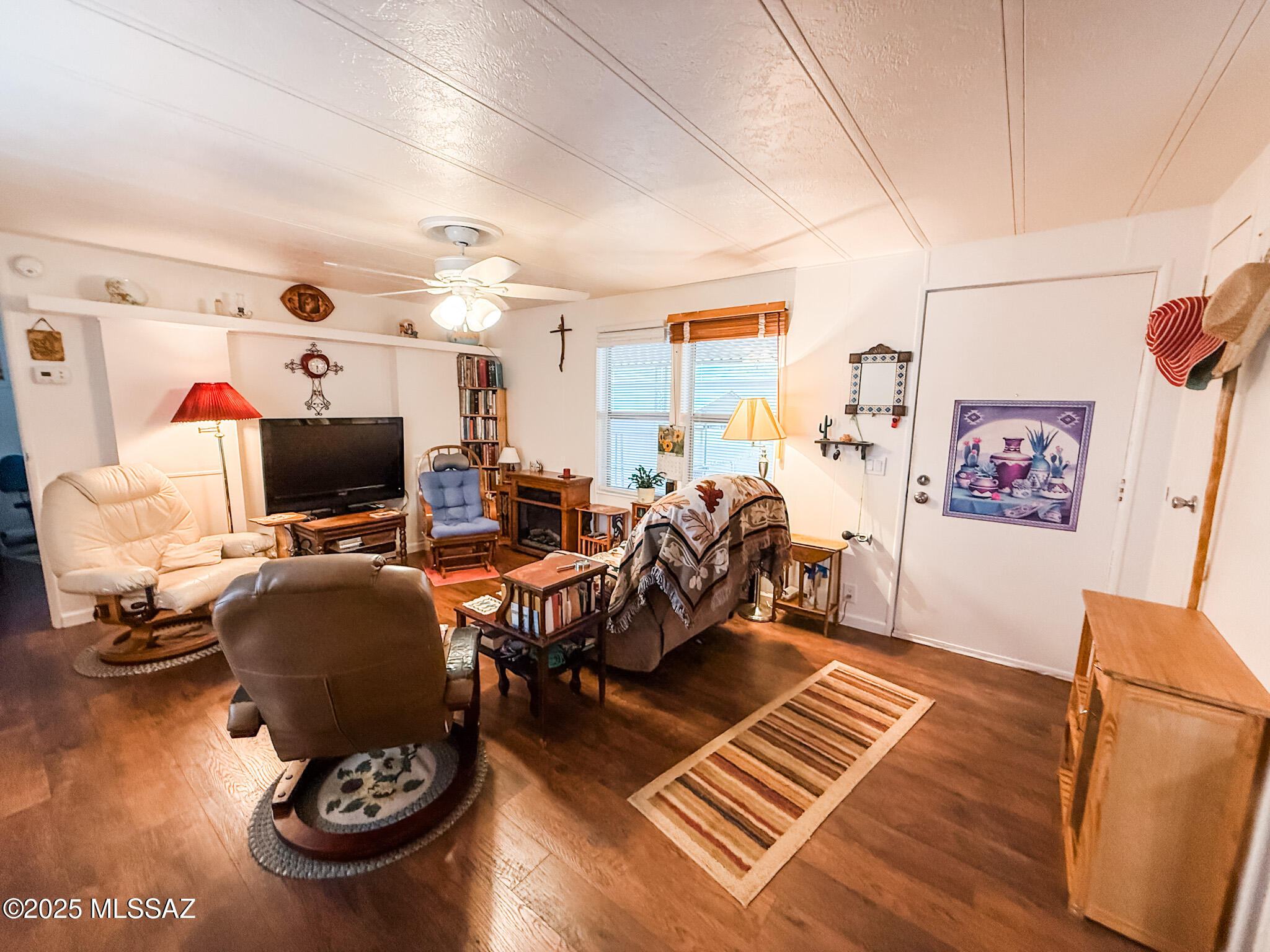 PRICE IMPROVEMENT! Updated 2 bed, 1.5 bath 1985 Redman(14'×64') in a welcoming 55+ land lease community. Recently refreshed with new laminate flooring, interior/exterior paint, brand-new refrigerator, gas stove, dishwasher, water heater, high toilets, and walk-in shower. A $7,000 upgrade of energy-efficient windows just installed. Exterior updates include a new deck, rear landing, and landscaping. Systems improved with overhauled A/C (2025), gas furnace, updated valves, outlets, switches, LED lighting, and ceiling fans. Home leveled, insulation inspected, and roof coated. Washer/dryer and select furniture convey. Sale is for home only on leased land; buyers must be 55+ with park approval. Lot rent includes water. Move-in ready! Price is for home, not on owned land, lot rent is $390 per mo