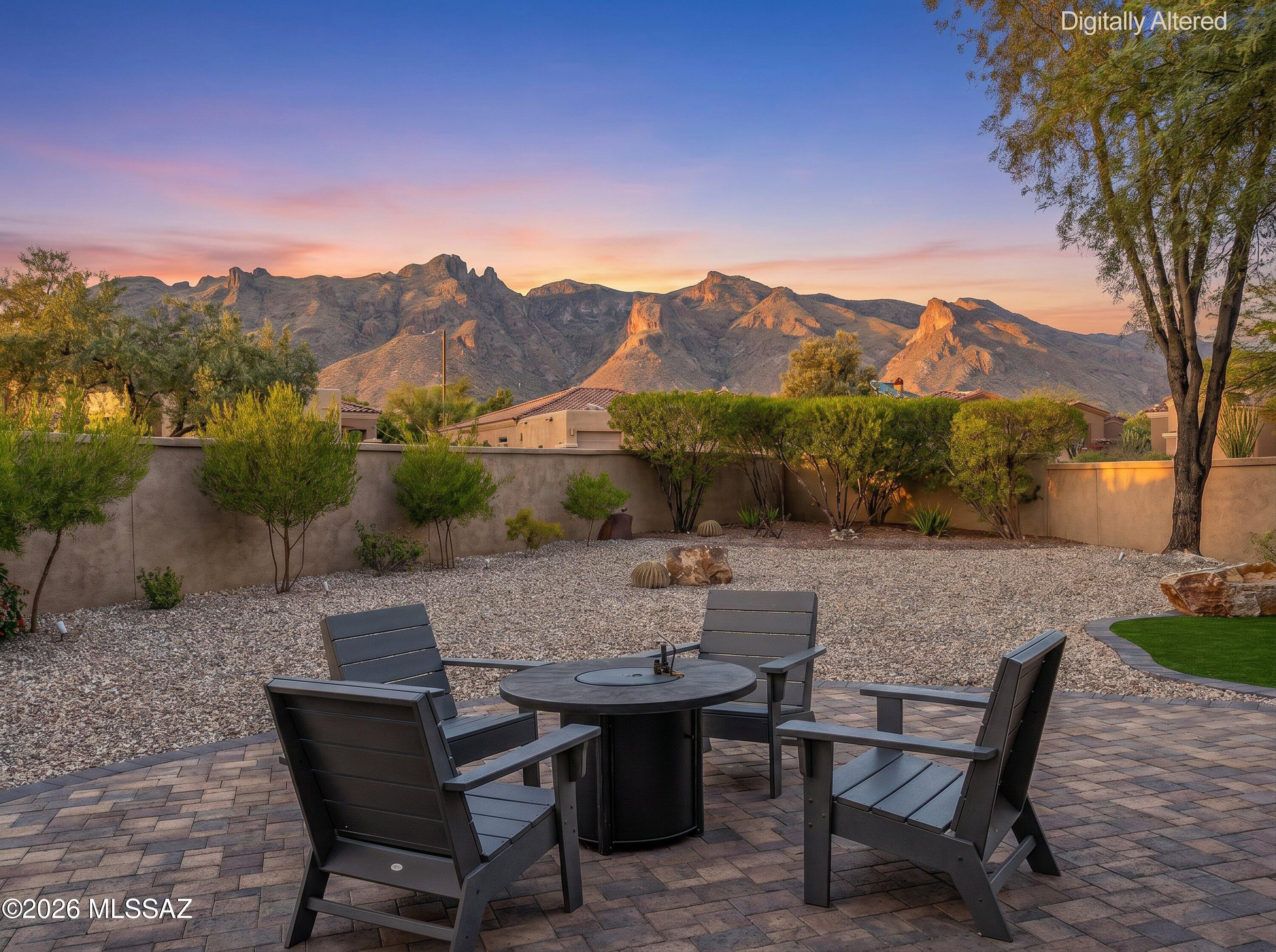 WOW!! Hidden GEM in La Paloma! This absolutely stunning 3bd/3ba + den/office in the desirable guard gated Villages of La Paloma is also on one of the largest lots with breathtaking views of the Catalinas. The gas fireplace, high ceilings, custom shelves and lighting make this elegant house feel like home. The primary suite with a gas fireplace, walk in closet, door to a private patio, and a luxurious bathroom that includes a walk in shower, soaking tub and 2 separate vanities!  A beautifully designed chef's kitchen with granite countertops and a great island! French doors open to a backyard perfect for enjoying Tucson's weather, including an amazing outdoor kitchen! 3 car garage! 1 car garage could be a workshop,  gym, or studio. Buyer to verify all facts and figures including those in MLS
