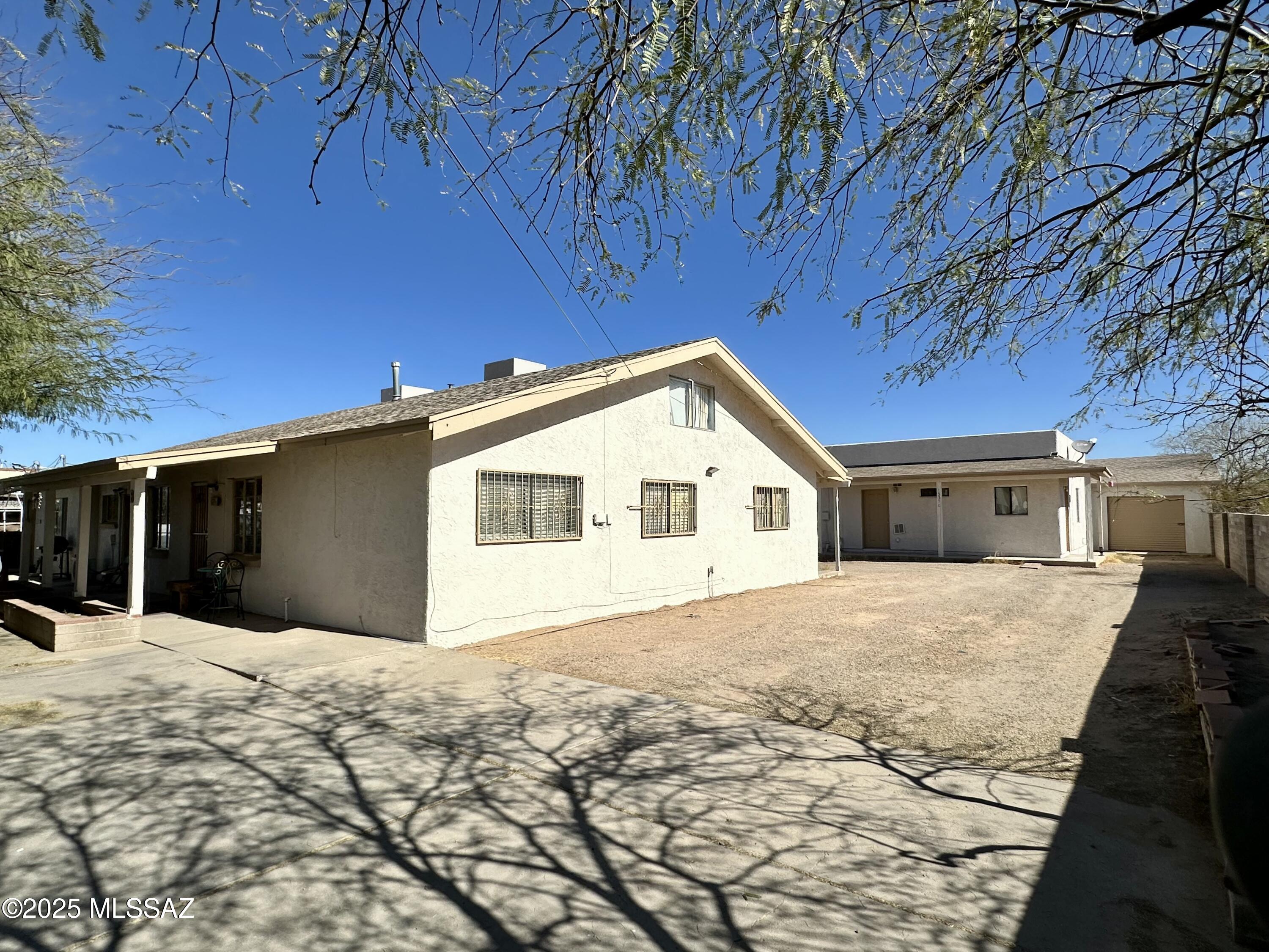 Ready to elevate your investment portfolio? Consider this Quadruplex! Opportunity for a savvy investor looking to scale up assets. Unit#A 1375ft.² 3/2 w/loft.. #B 1057ft.² 2/2 w/loft.. #D 225ft.² Studio..
Detached casita #C 600ft.² 1/1. Square footage to be verified. 3 rental storage units 8x8x9high & Rental Garage/Work shop 18x14. Large .34 acre lot w/ Block perimeter wall features 10+on-site parking. Recently painted exterior. Destination area for Gem Show,  New Mosaic Iceplex, Kino Sports Plex, Tucson Rodeo, Sports competitions, Shopping, Restaurants & Entertainment Galore. With the Right business plan the Right opportunity knocks..