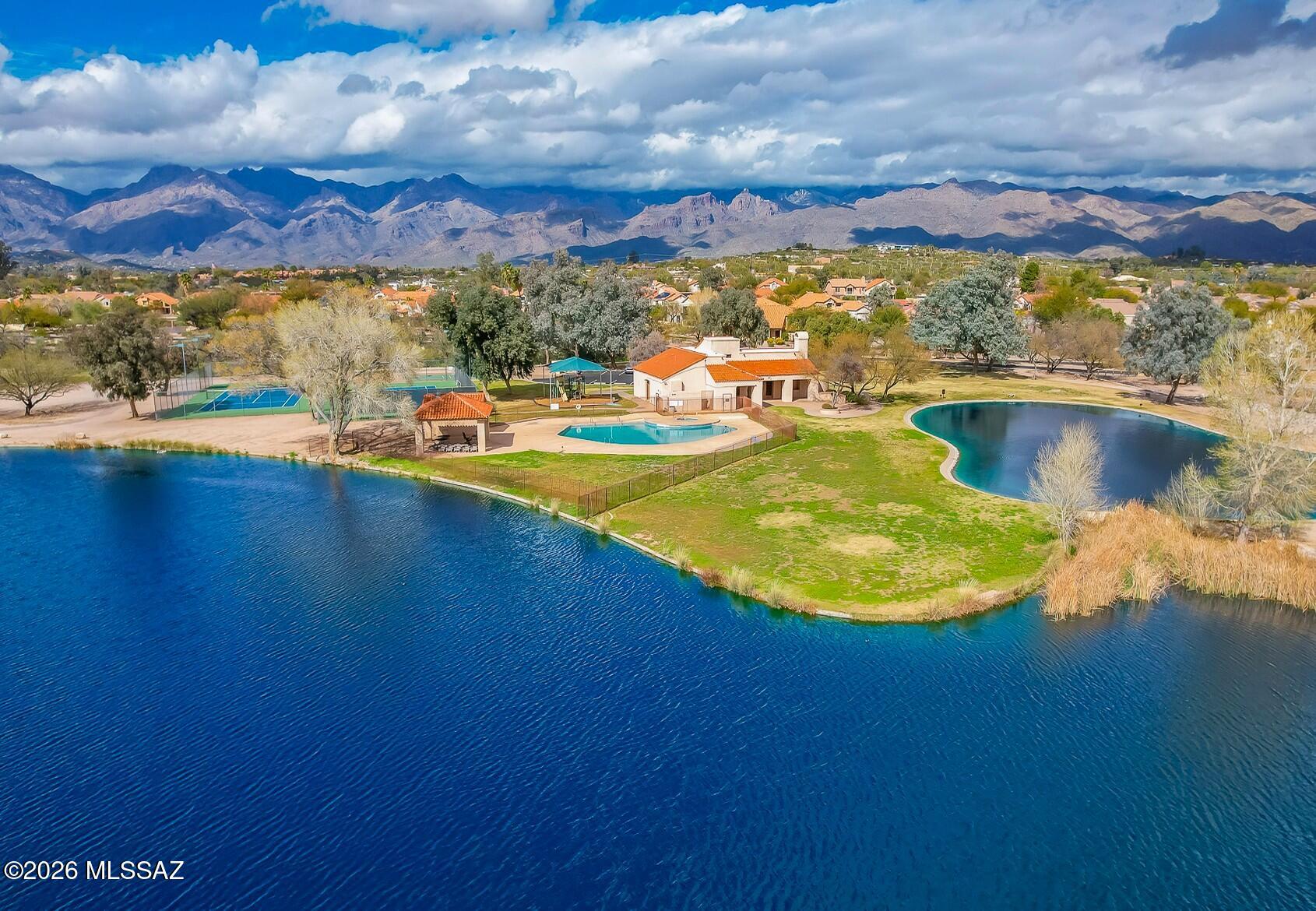 Beautifully updated home in Tanque Verde Valley's pristine, gated ''The Lakes at Castle Rock''. Perfectly located on a premium cul-de-sac corner lot, this COMPLETELY RENOVATED single-story home offers a rare turn-key option in this sought-after Community. Enjoy pristine lakes, tennis courts, community pools &  inviting walking trails. Comprehensive improvements include a stunning kitchen w/ modern cabinets, sleek granite counters & spacious breakfast-bar island. Versatile floorplan offers 2nd Living Room that could also be 2nd primary bedroom. Gorgeous new Modern bathrooms plus new tile flooring, lighting & fixtures throughout. Spacious North-facing backyard full of fruit trees & cozy patios. Also Newer Water Heater '23 HVAC '21 & Roof underlayment '24. Listing Agent related to Seller.