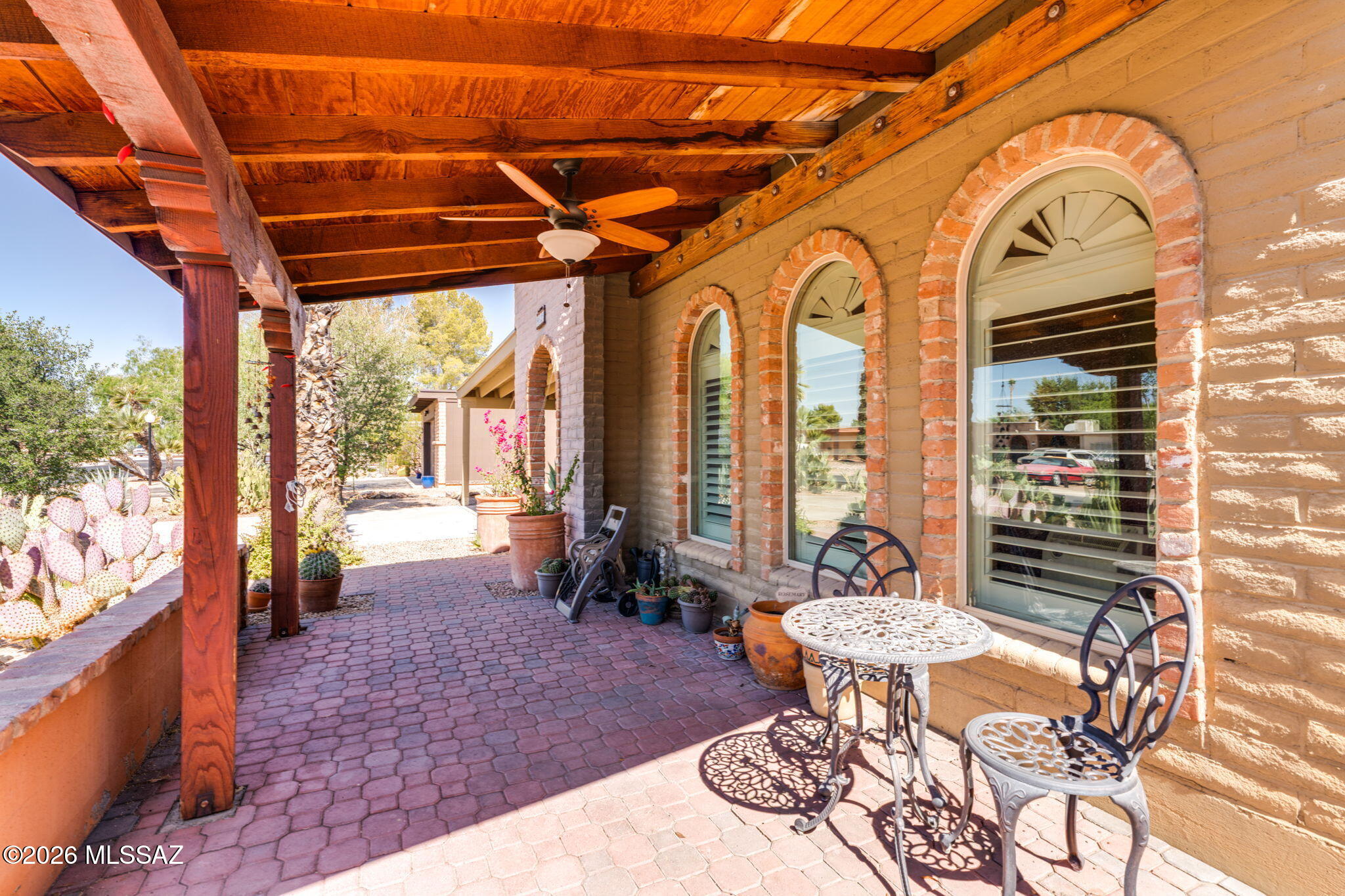 Welcome to this beautifully maintained, pride-of-ownership home, offering 3 spacious bedrooms and 2 full bathrooms. Large, covered carport and storage leads you into the entry door. Step inside to a light-filled living space, with huge arched windows framing the desirable front yard. Ceramic tile runs throughout, and custom kitchen elevates the design. Enjoy peace of mind with brand new roof and new HVAC system. Work from home in the dedicated office area. A large Arizona room, perfect for year-round enjoyment, plus there is a separate laundry room just off the AZ room for added convenience, Don't miss your chance to own this gem - schedule your private tour today!